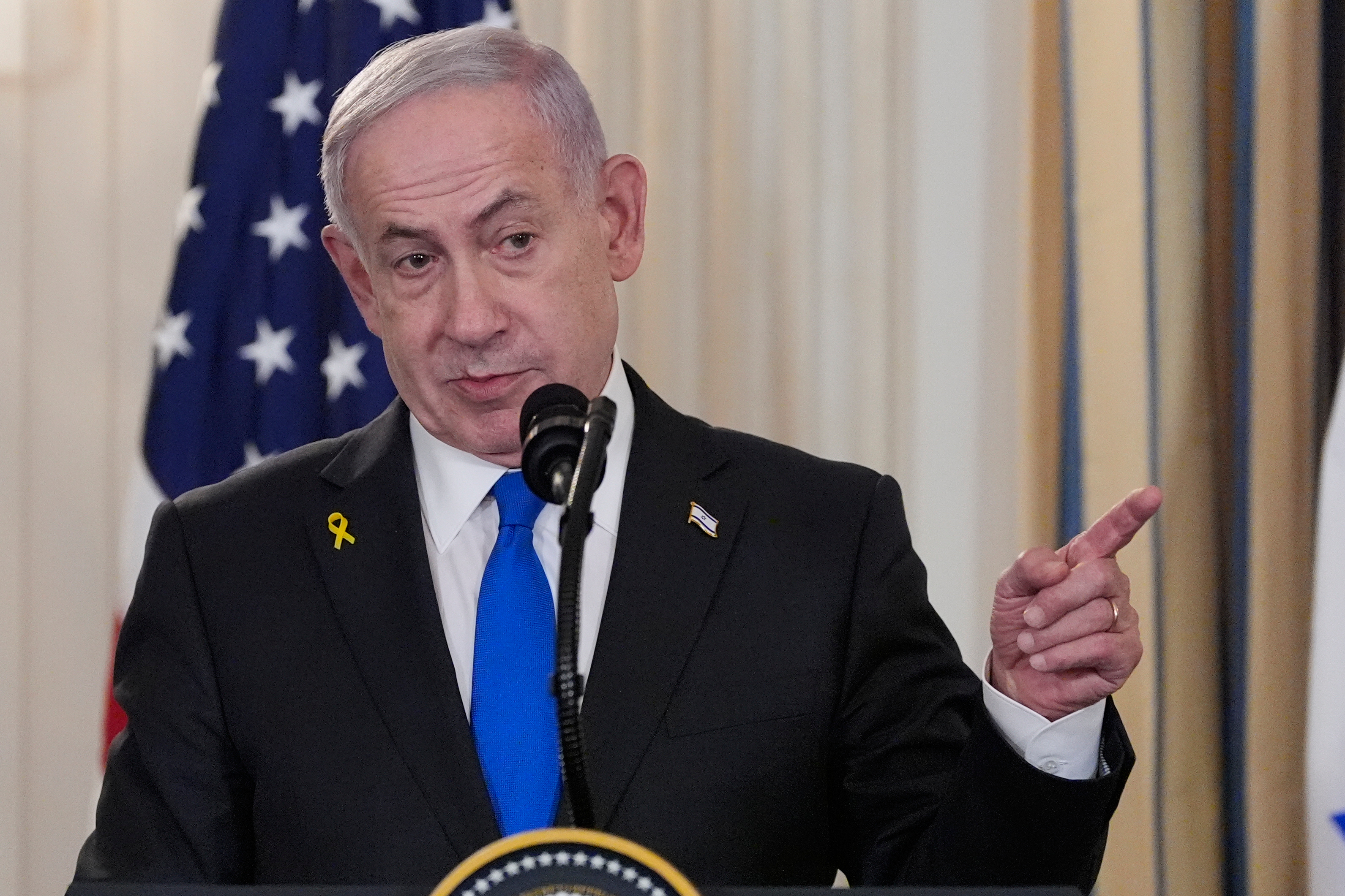 Israel's Prime Minister Benjamin Netanyahu speaks during a news conference with President Donald Trump