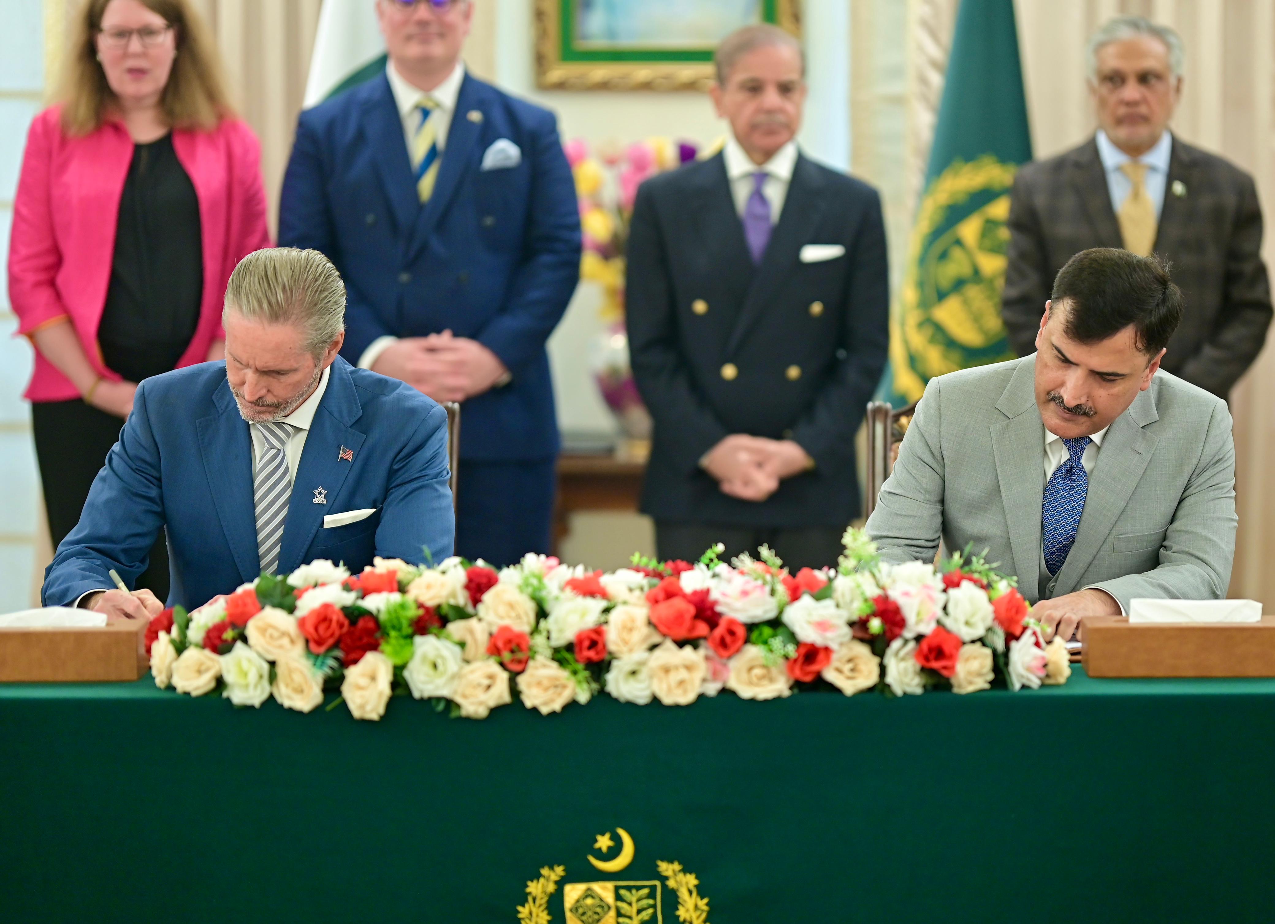A private American firm USSM signed a memorandum of understanding with Pakistan's military-run Frontier Works Organisation. [Handout/Pakistan Prime Minister's Office]
