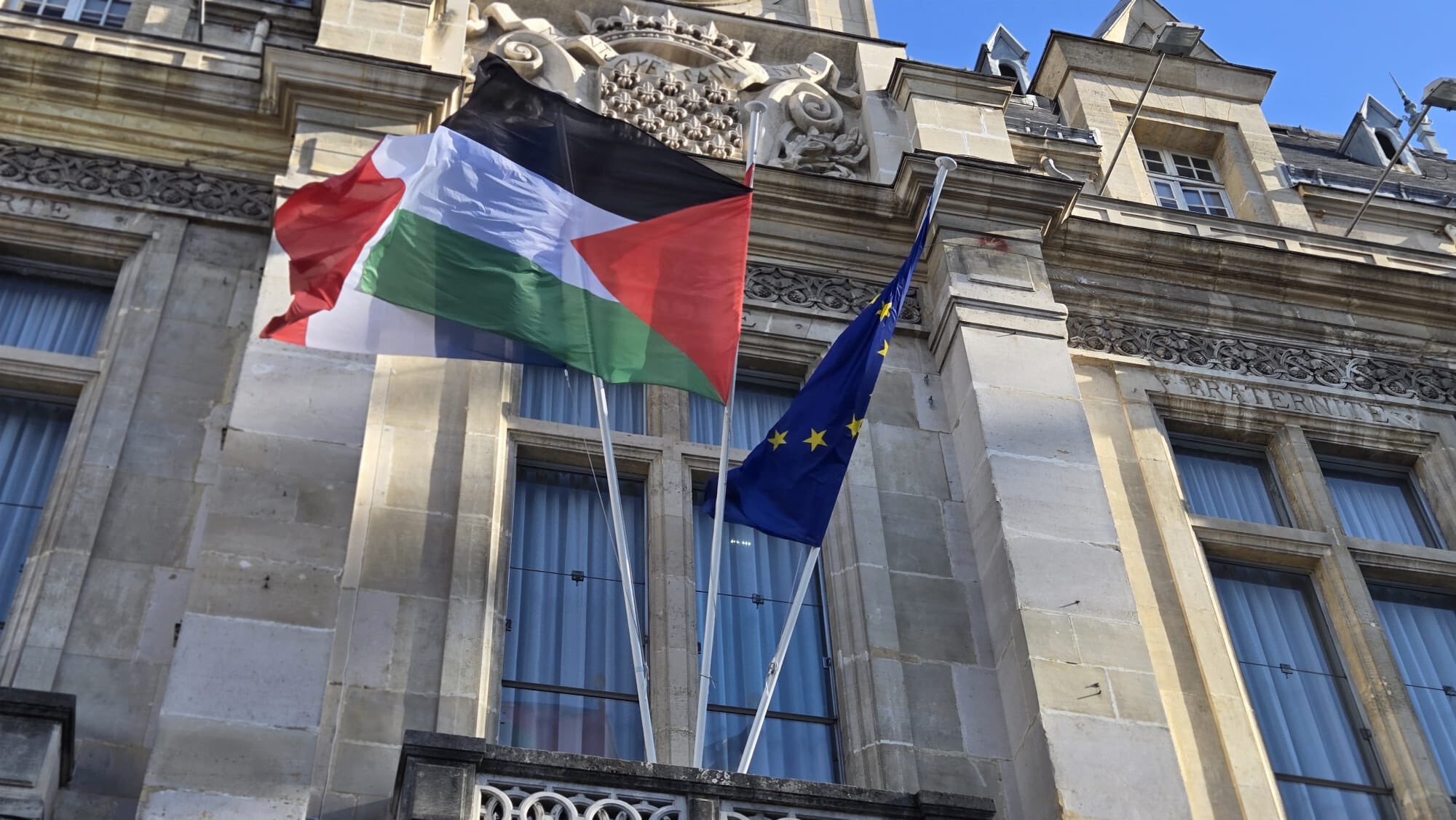 The Palestinian flag is hoisted on the Saint-Denis town hall in Paris.