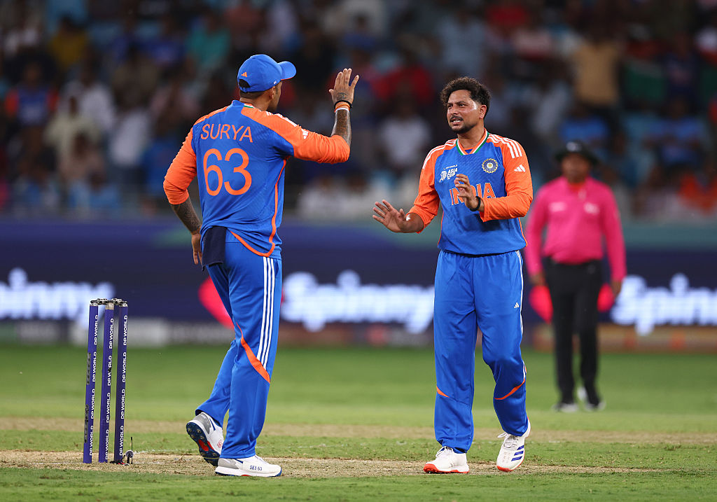 Kuldeep Yadav of India celebrates with Suryakumar Yadav of India after dismissing Muhammad Waseem of UAE during the Asia Cup match between India and United Arab Emirates at Dubai International Stadium on September 10, 2025 in Dubai, United Arab Emirates.