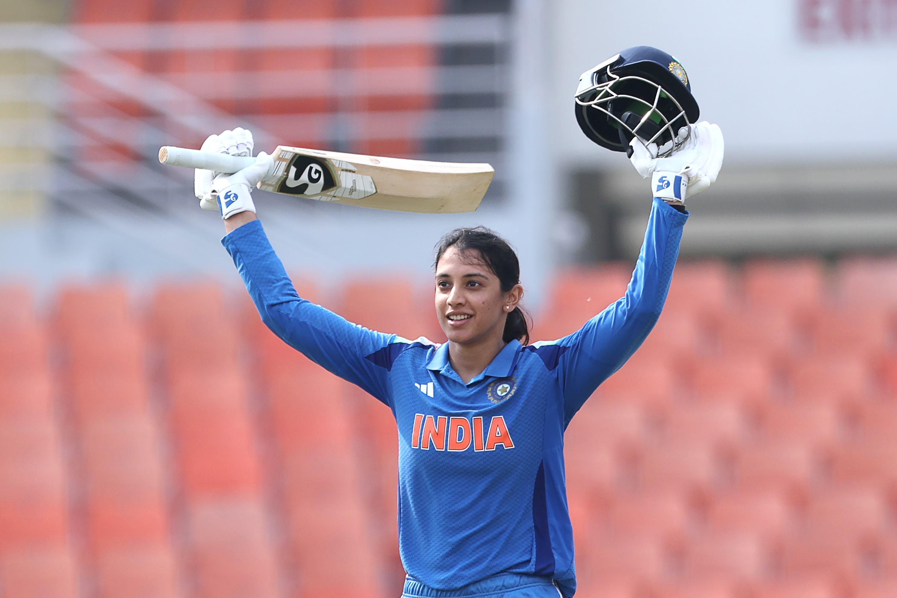 CHANDIGARH, INDIA - SEPTEMBER 17: Smriti Mandhana of India celebrates after scoring a hundred during game two of the Women's ODI series between India and Australia at Maharaja Yadavindra Singh International Cricket Stadium on September 17, 2025 in Chandigarh, India. (Photo by Pankaj Nangia/Getty Images)