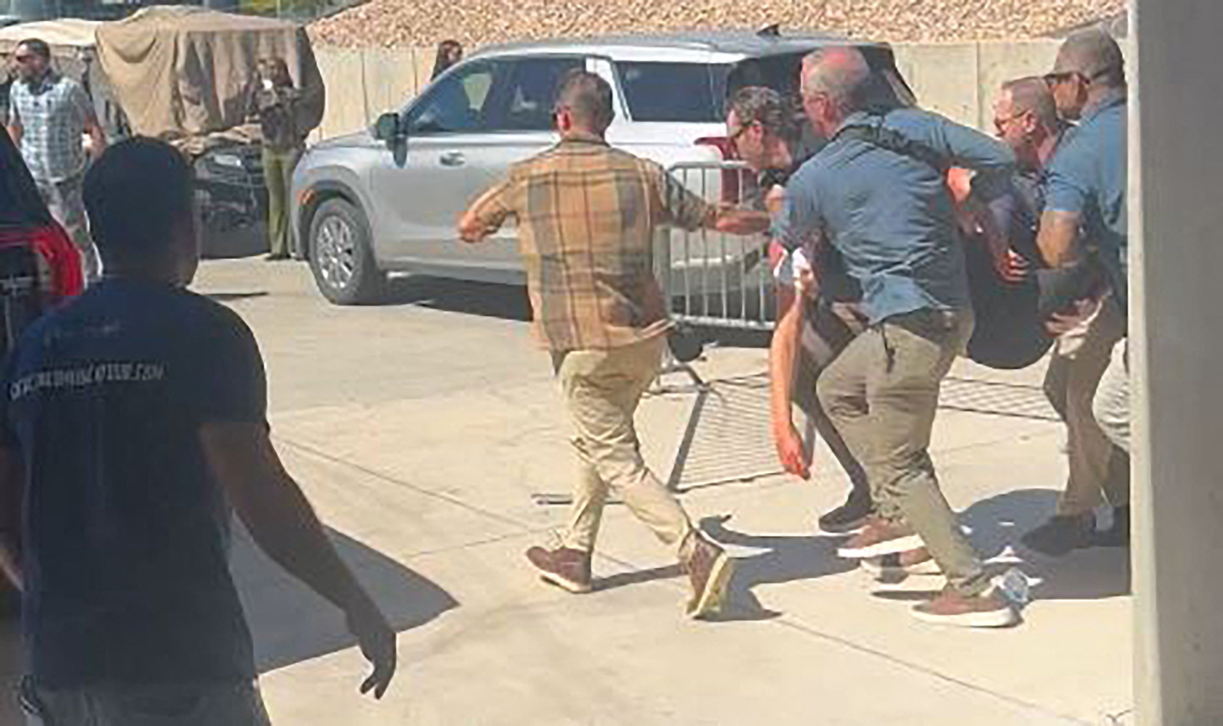 This screen grab from a video by Jeremy King shows security personnel carrying right-wing youth activist and influencer Charlie Kirk after he was shot during a public event at Utah Valley University in Orem, Utah, on September 10, 2025.