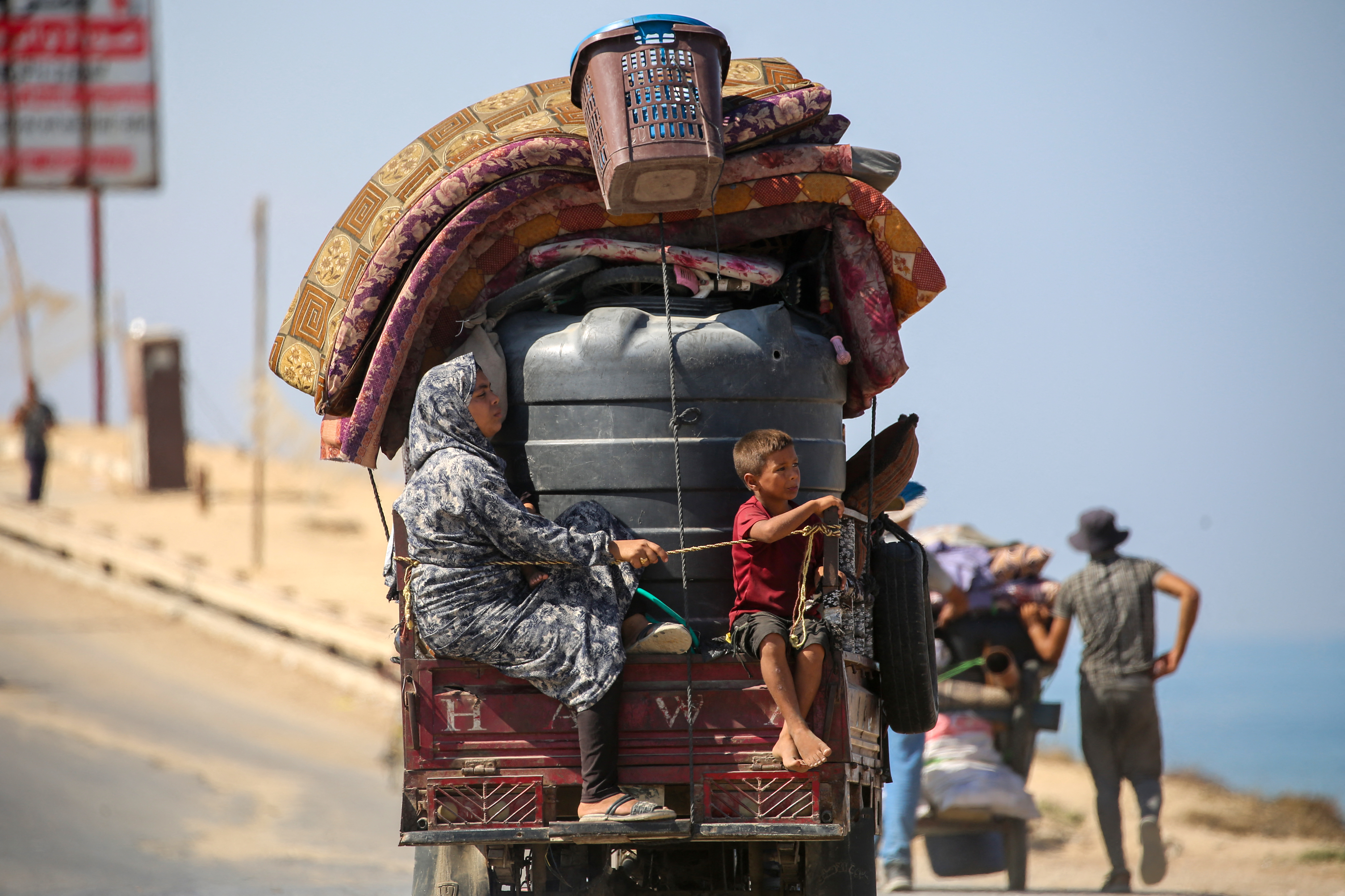 Palestinians transport their belongings as they evacuate Gaza City towards southern areas of the coastal Gaza Strip, on September 11, 2025.