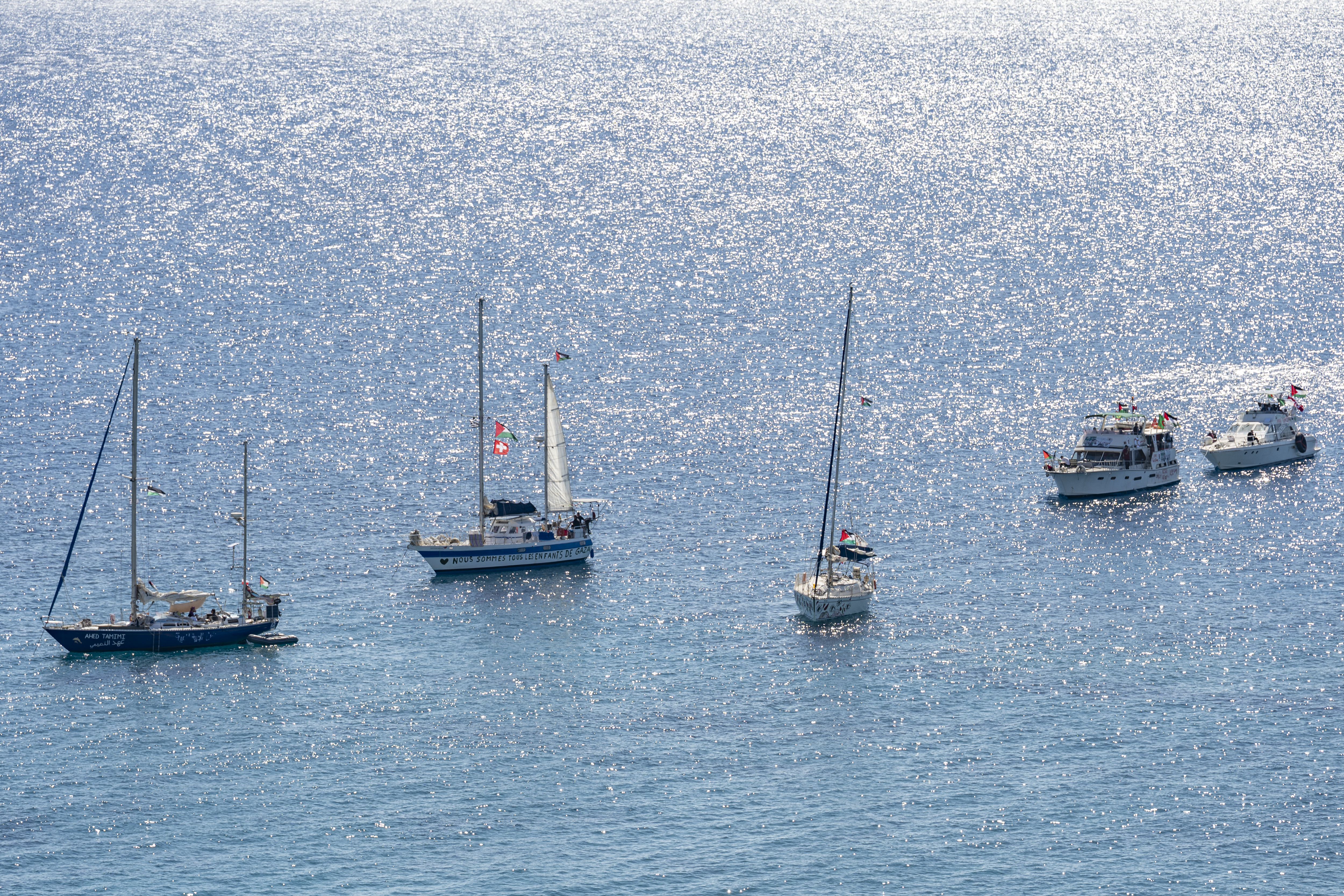 A group of ships of the Global Sumud Flotilla to Gaza are shown moored at the small island of Koufonisi, south of the island of Crete on September 26, 2025.