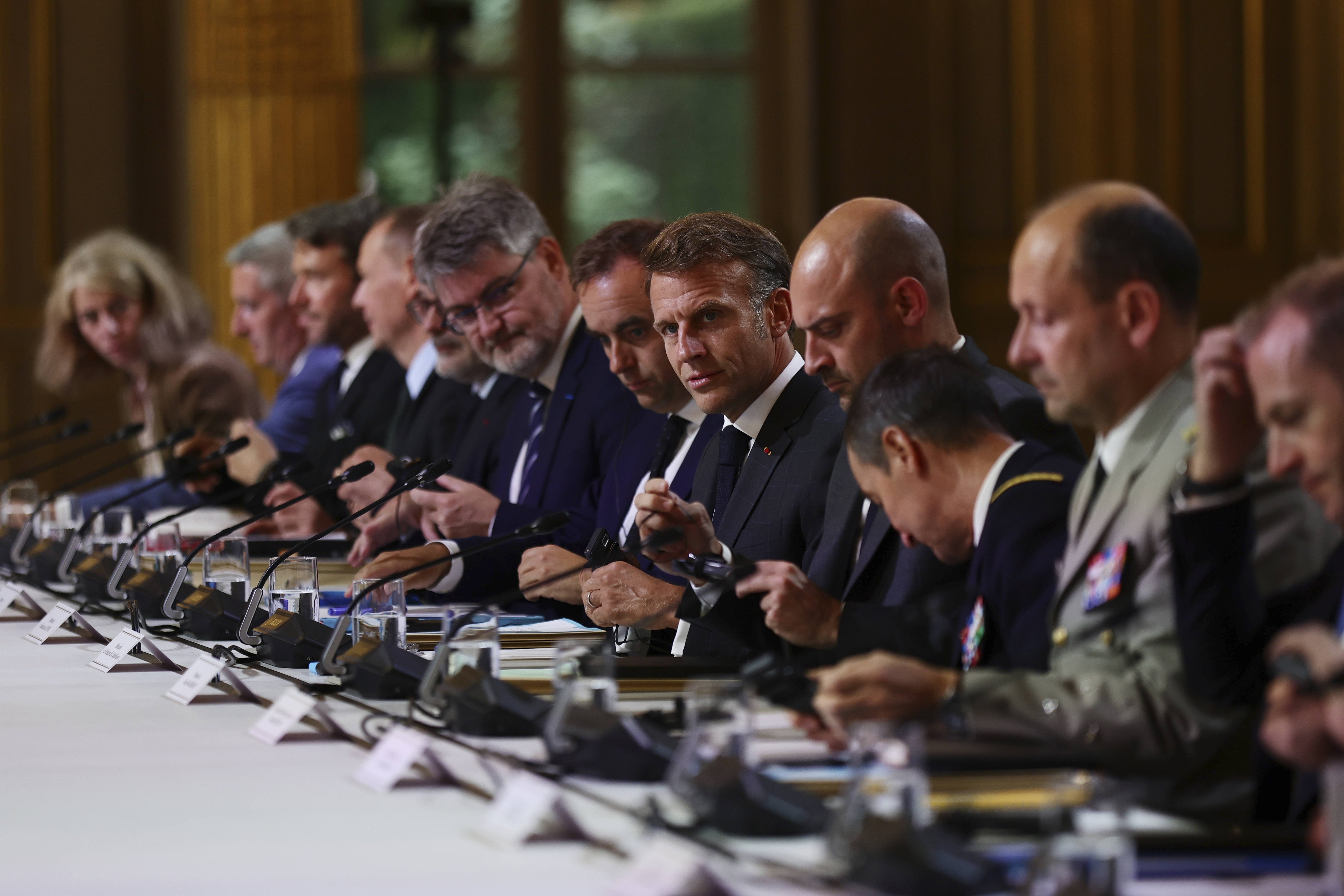 France's President Emmanuel Macron, center, attends a meeting with Ukraine's President Volodymyr Zelenskyy, unseen, at the Elysee Palace, in Paris, France, Wednesday, Sept. 3, 2025. (Teresa Suarez/ Pool Photo via AP)