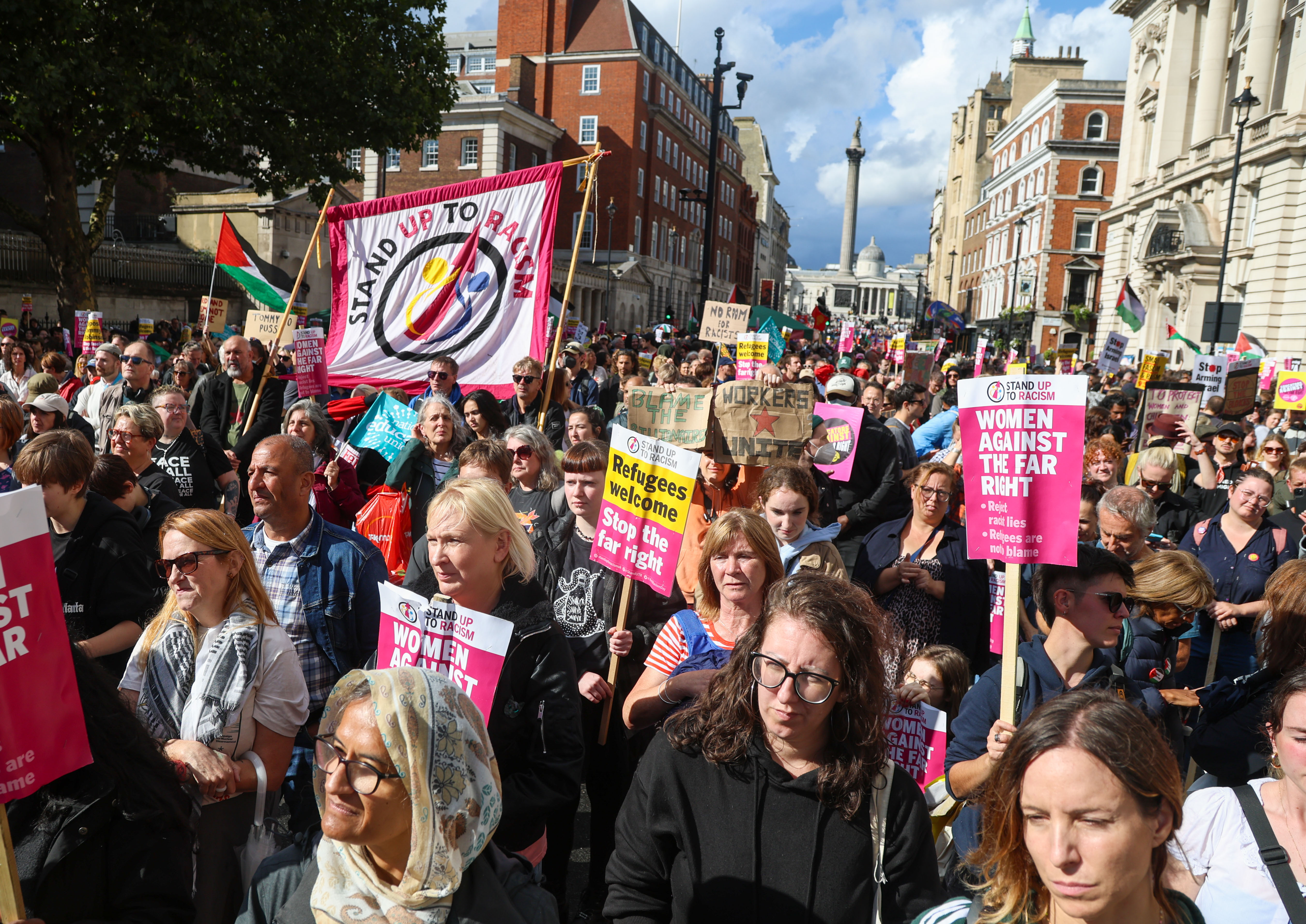 epa12373622 Anti-racism demonstrators display placards during a 'Stand Up to Racism' protest in London, Britain, 13 September 2025. Two opposing demonstrations, involving tens of thousands of participants, are currently underway in London. A far-right 'Unite the Kingdom' rally led by activist Tommy Robinson, and a counter-protest by anti-racism campaigners under the banner of 'Stand Up to Racism'. EPA/TAYFUN SALCI