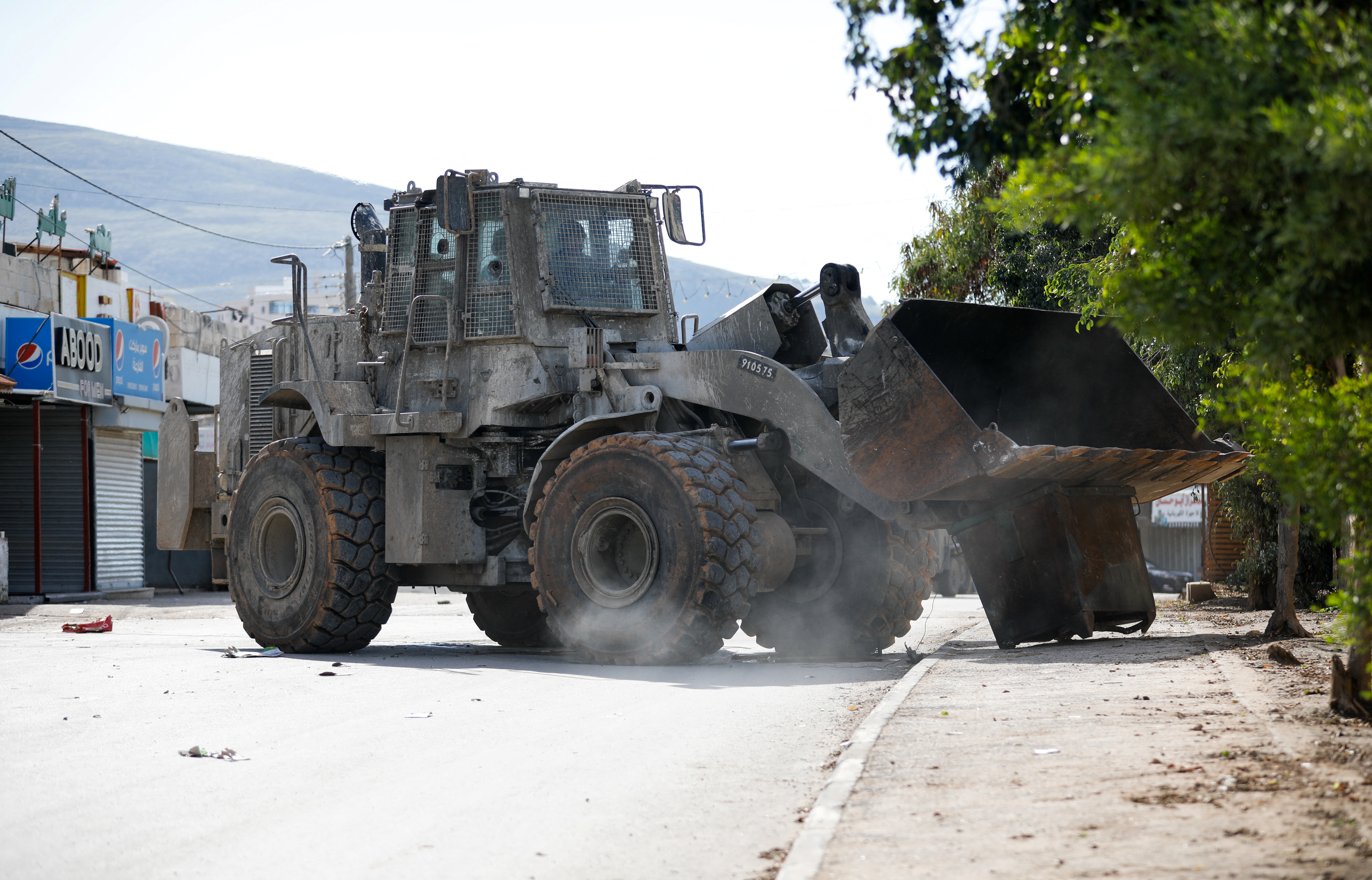 An Israeli army bulldozer operates during a raid in Faraa refugee camp, near Tubas in the Israeli-occupied West Bank.