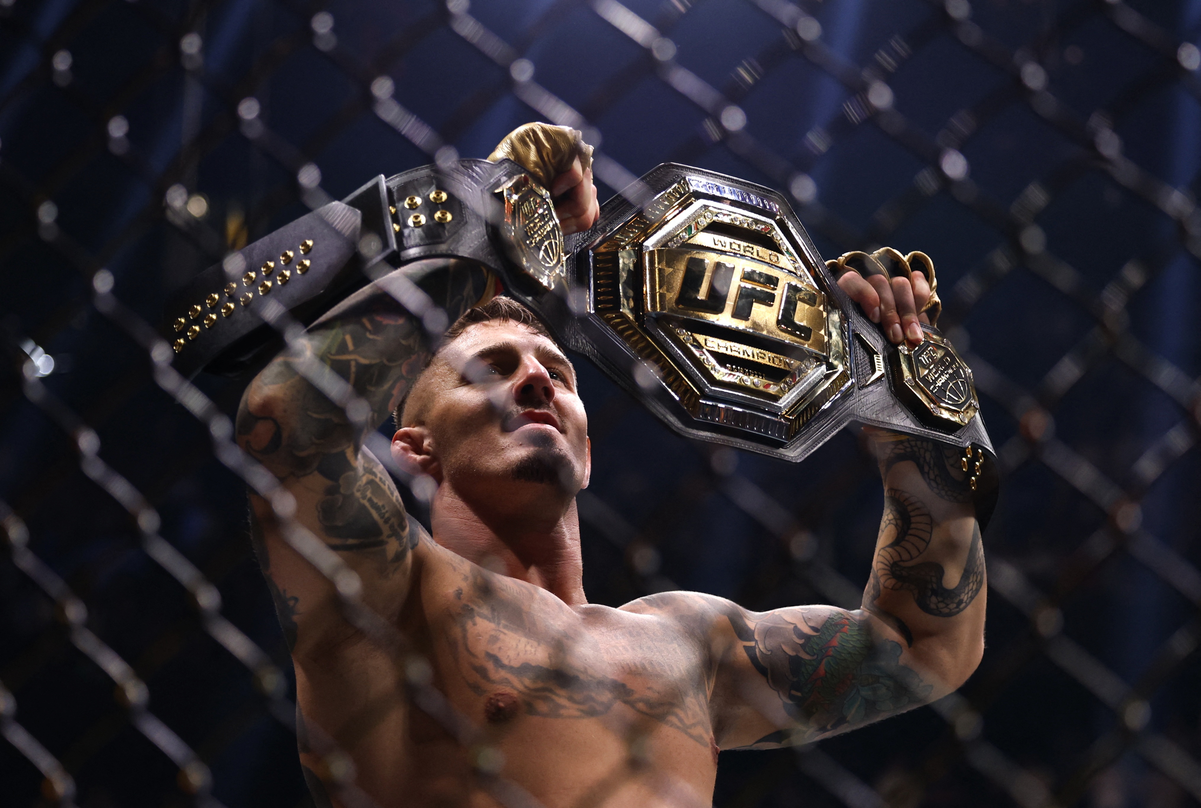 Tom Aspinall celebrates after winning his fight against Curtis Blaydes