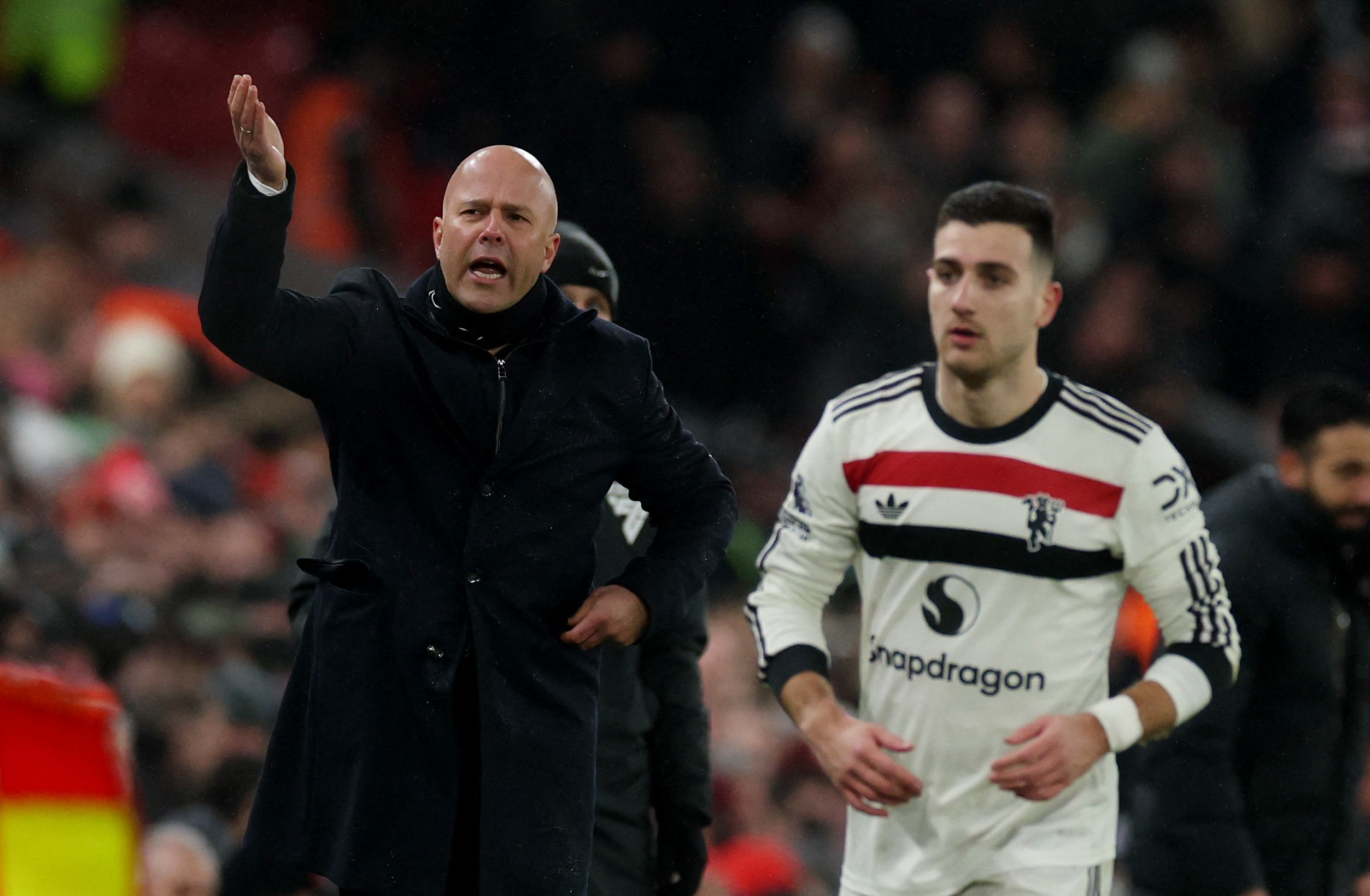 Liverpool manager Arne Slot managing his side against Manchester United in the Premier League