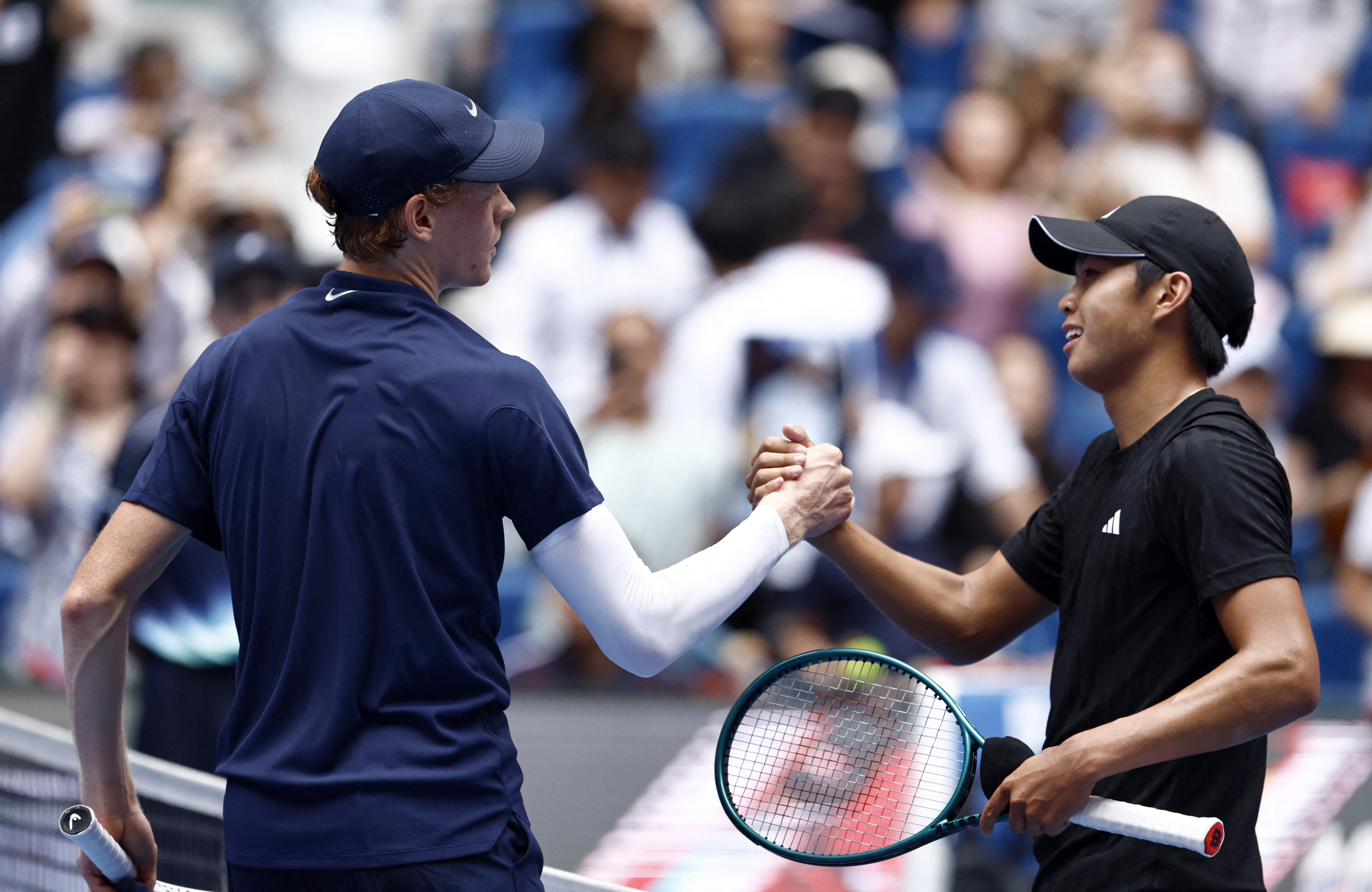 Sinner and Tien shake hands.