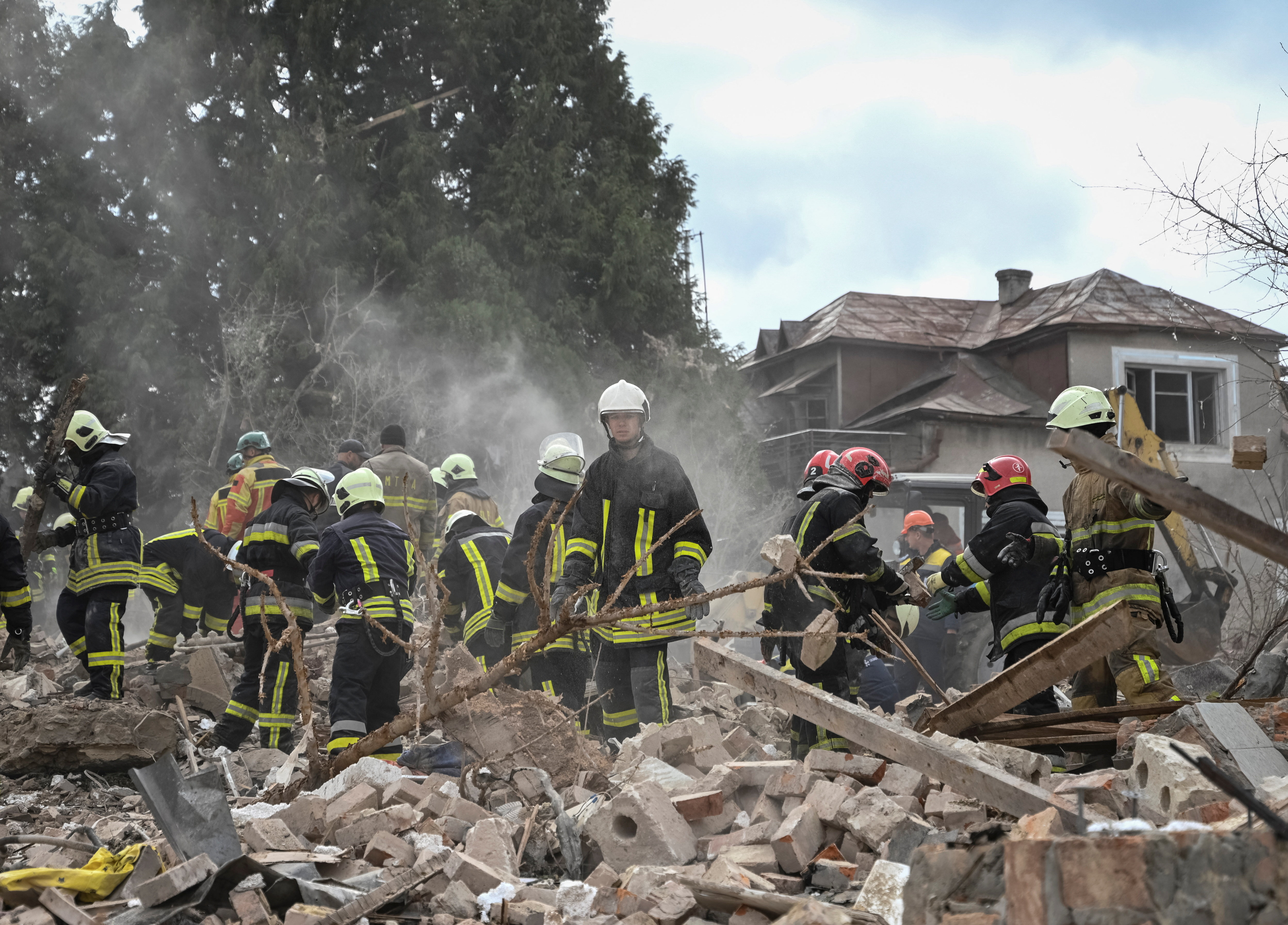 Rescuers work at the site of a house destroyed during a Russian drone and missile strike, amid Russia's attack on Ukraine, in the village of Lapaivka on the outskirts of Lviv, Ukraine October 5, 2025. REUTERS/Stringer