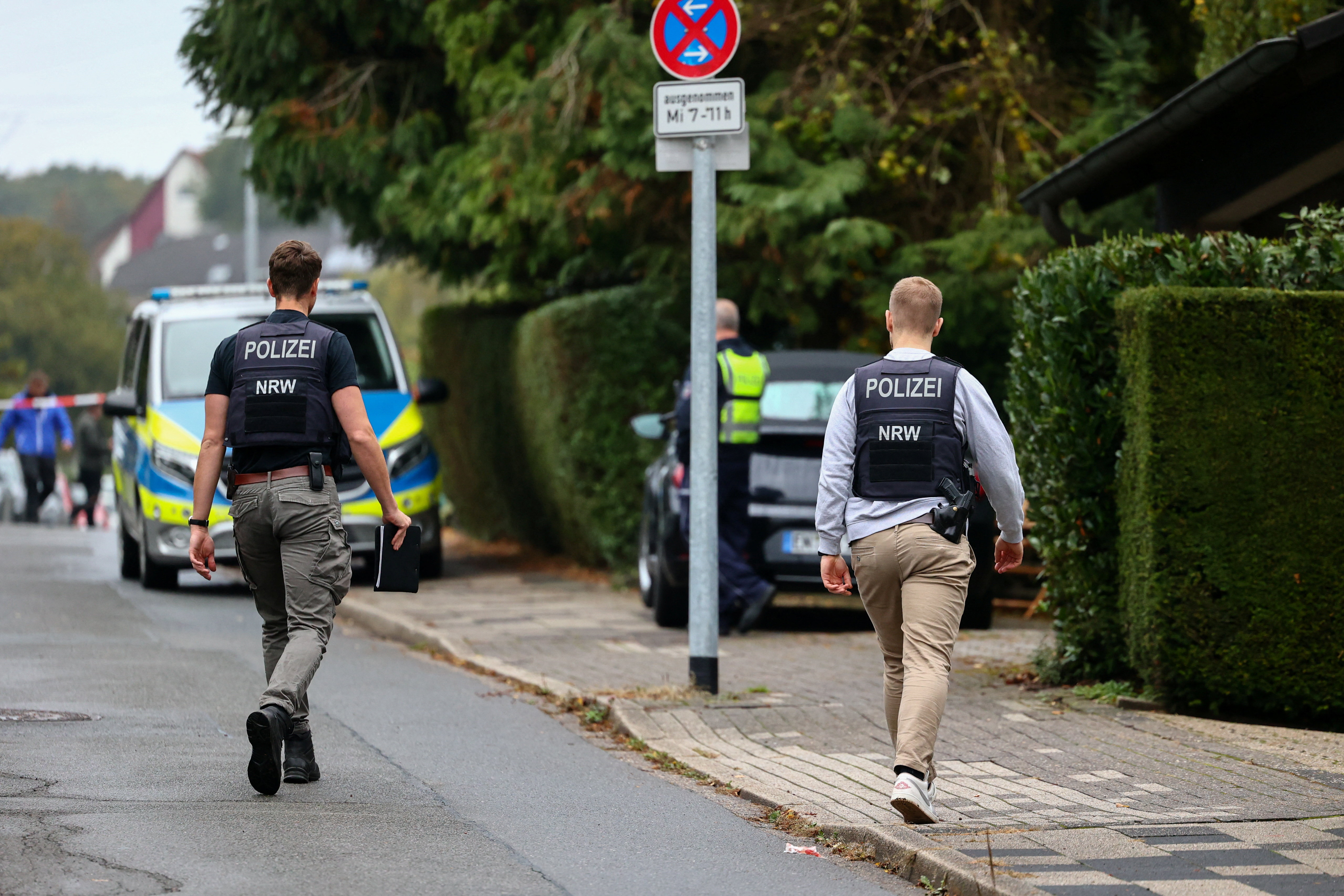 Police officers work at the scene after Herdecke's newly elected Mayor Iris Stalzer was found seriously injured in a stabbing incident, in Herdecke, Germany, October 7, 2025. REUTERS/Leon Kuegeler