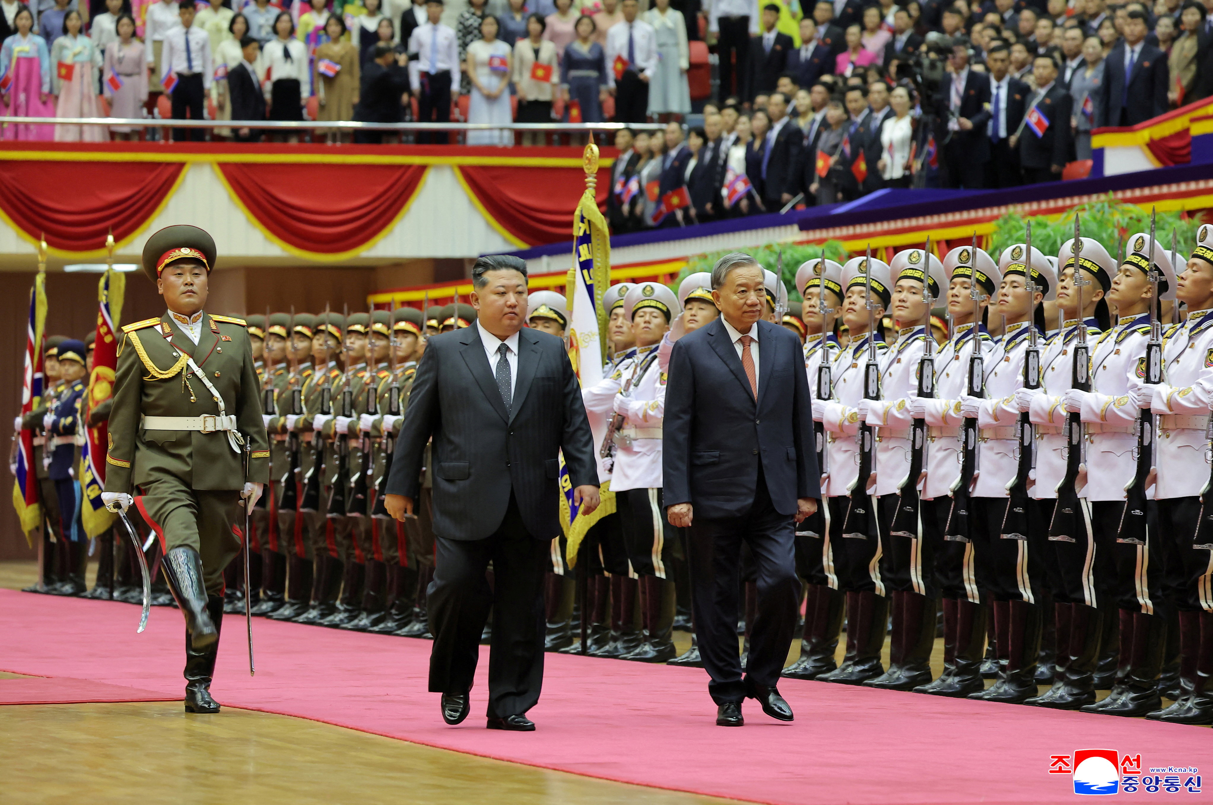 North Korean leader Kim Jong Un and General Secretary of the Communist Party of Vietnam To Lam review an honour guard during a welcoming ceremony as he visits the country for an event marking the 80th anniversary of the founding of the ruling Workers' Party of Korea (WPK), in Pyongyang, North Korea, October 9, 2025, in this pictured released October 10, 2025 by North Korea's official Korean Central News Agency