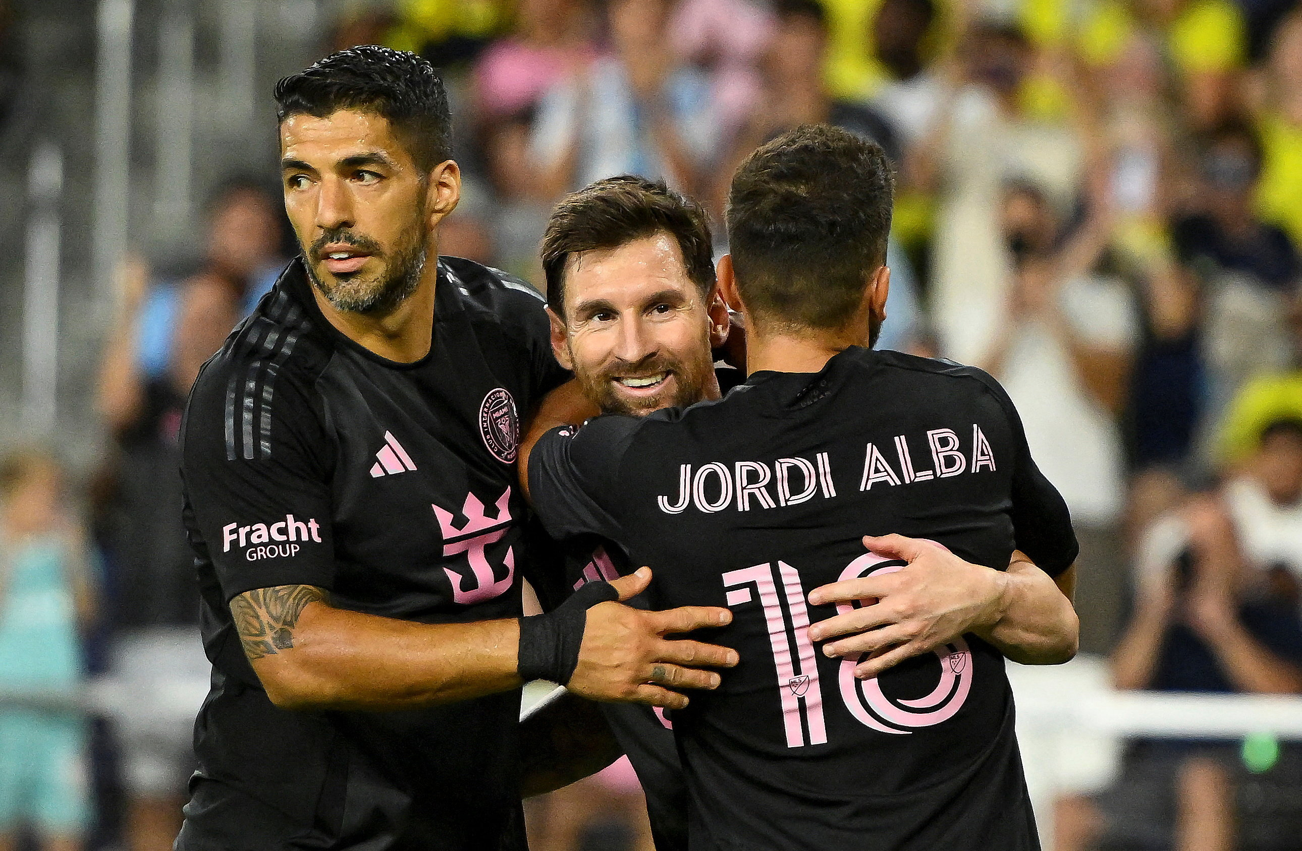 Inter Miami forward Lionel Messi celebrates with his teammates after scoring a goal against Nashville SC
