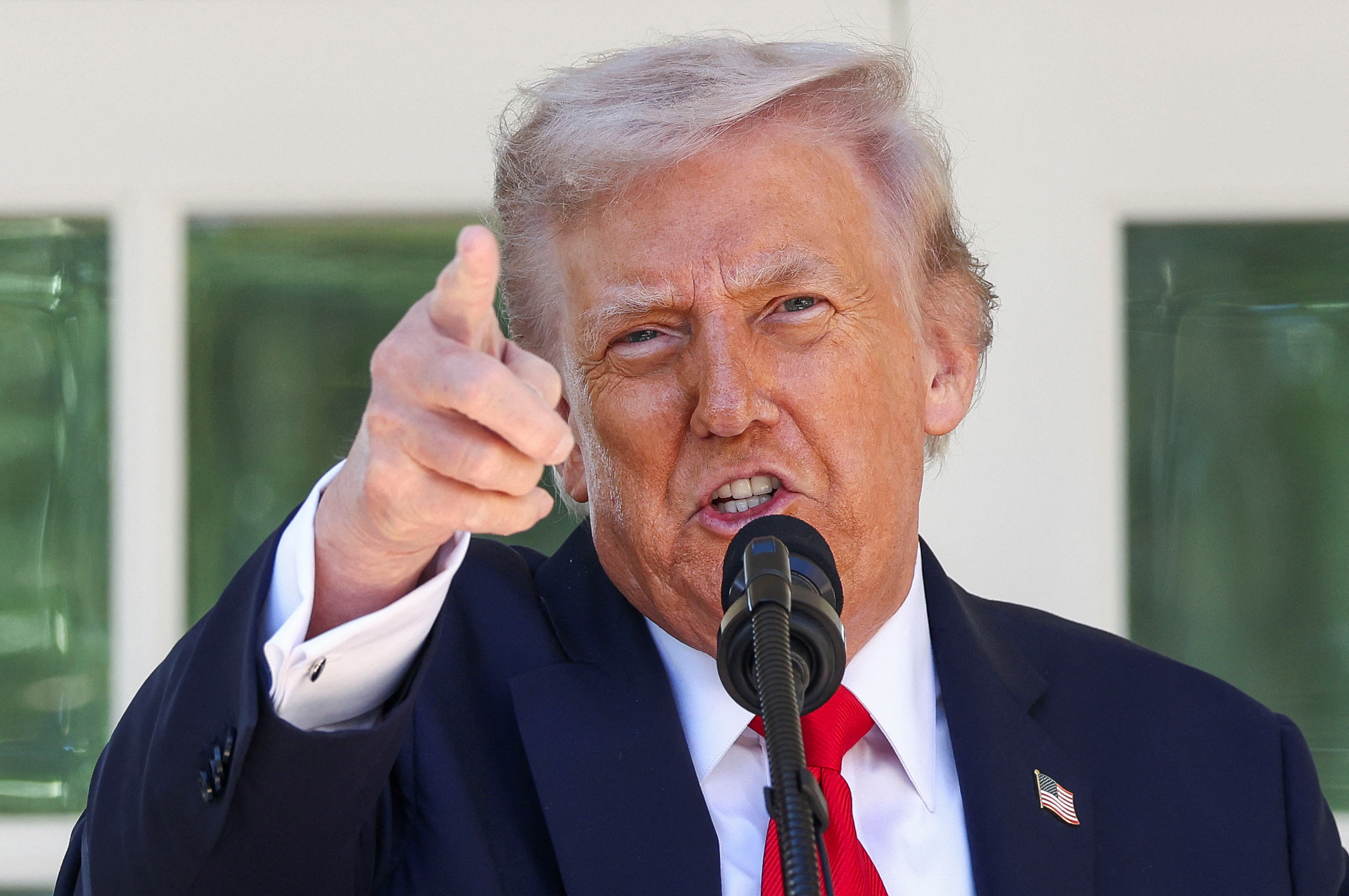 U.S. President Donald Trump gestures as he hosts a Rose Garden Club lunch at the White House in Washington, D.C., U.S., October 21, 2025. REUTERS/Kevin Lamarque