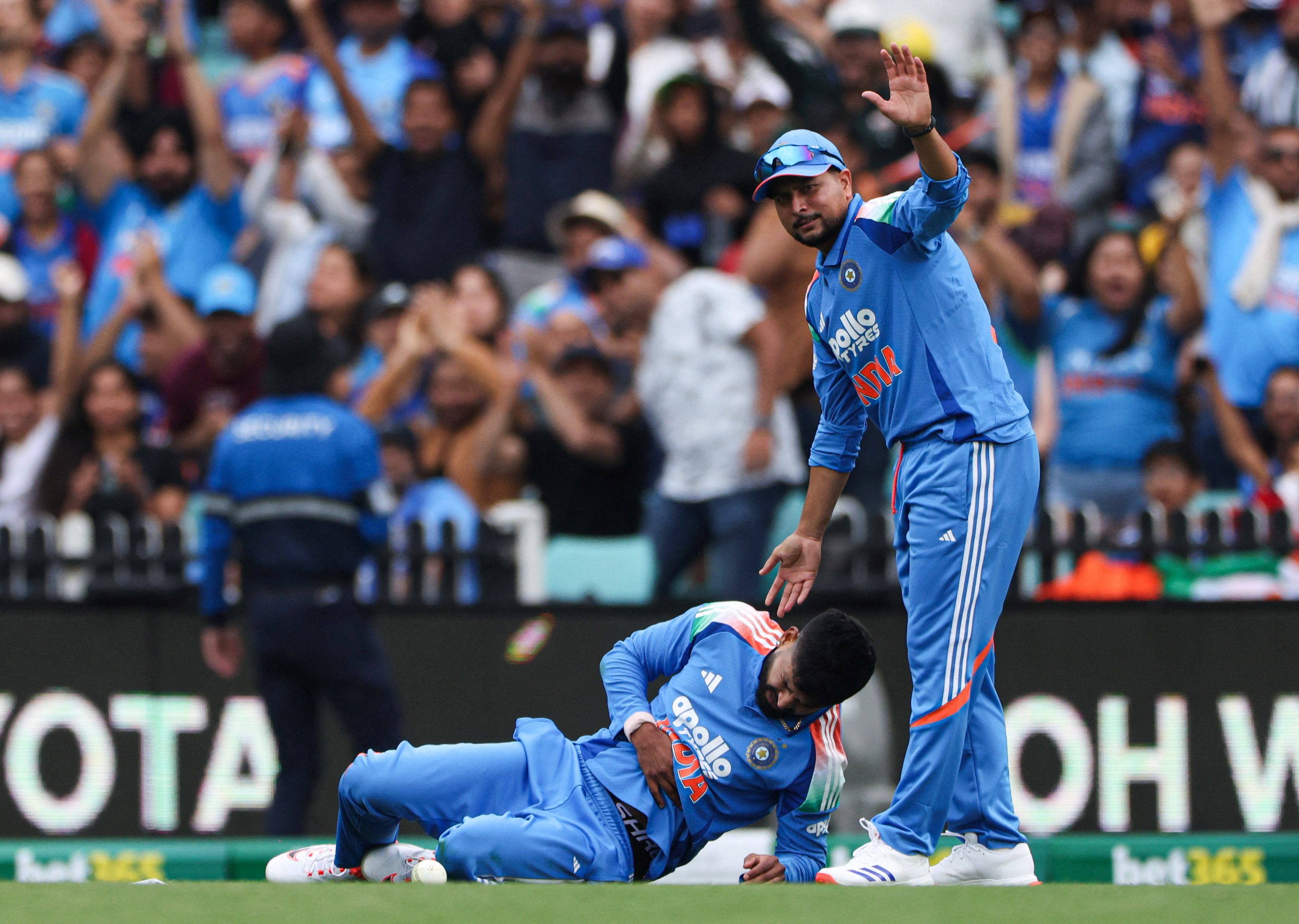 India's Shreyas Iyer reacts after taking a catch to dismiss of Australia's Alex Carey as India's Kuldeep Yadav looks on