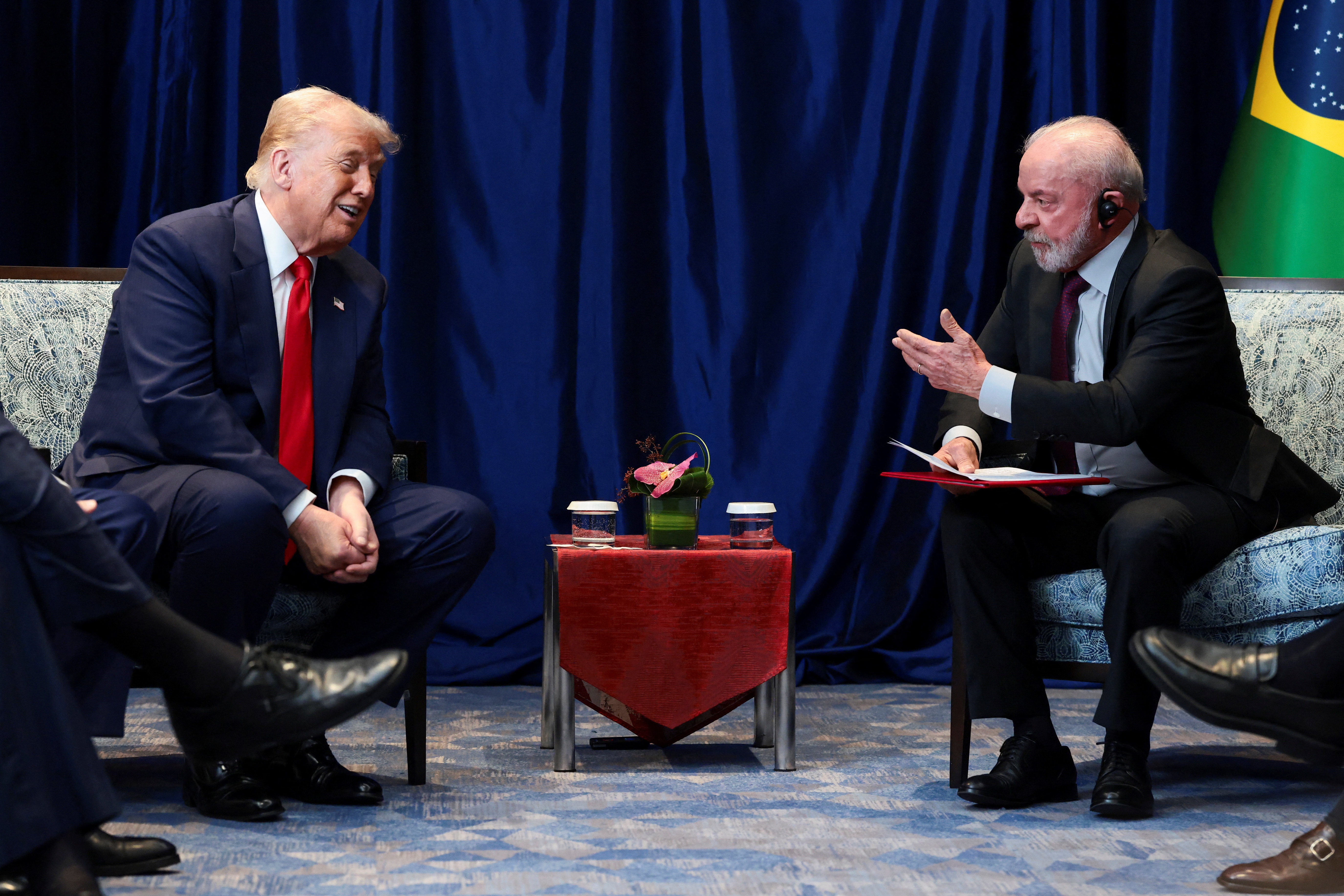 U.S. President Donald Trump and Brazilian President Luiz Inacio Lula da Silva talk as they meet on the sidelines of the 47th Association of Southeast Asian Nations (ASEAN) summit in Kuala Lumpur, Malaysia, October 26, 2025. REUTERS/Evelyn Hockstein