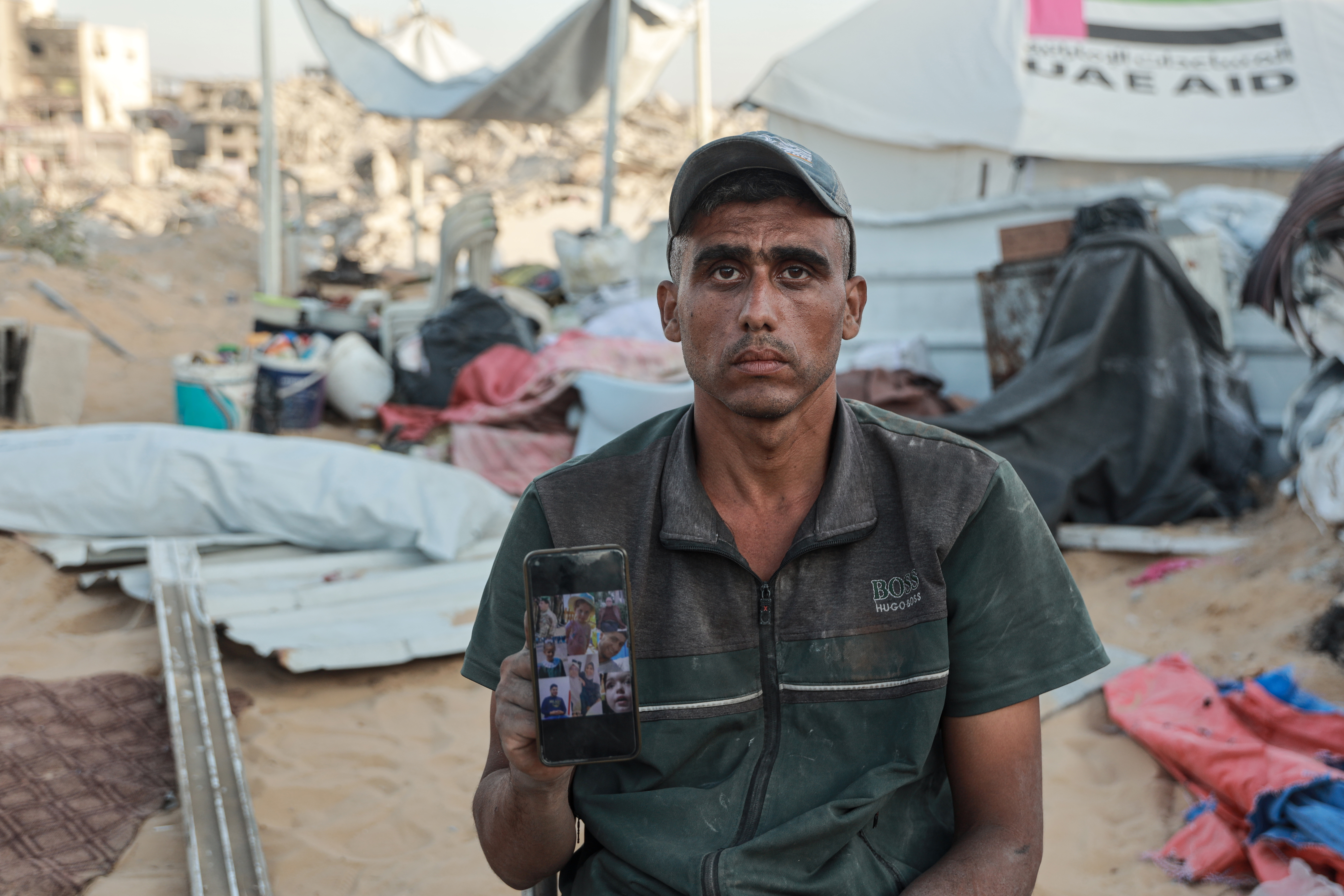 A man holds up a phone 