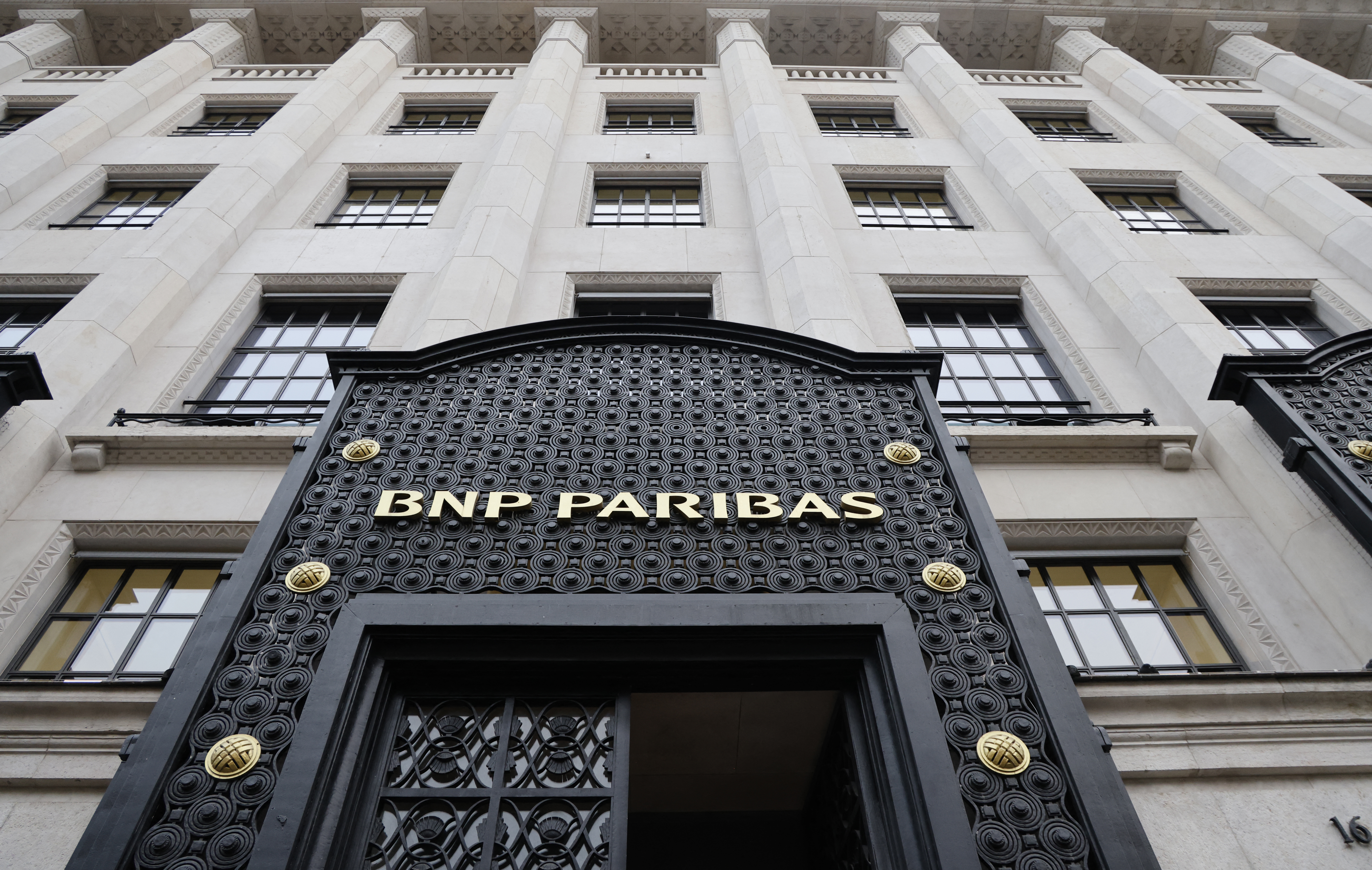 a black iron entry way to a building says bap paribas in gold letters