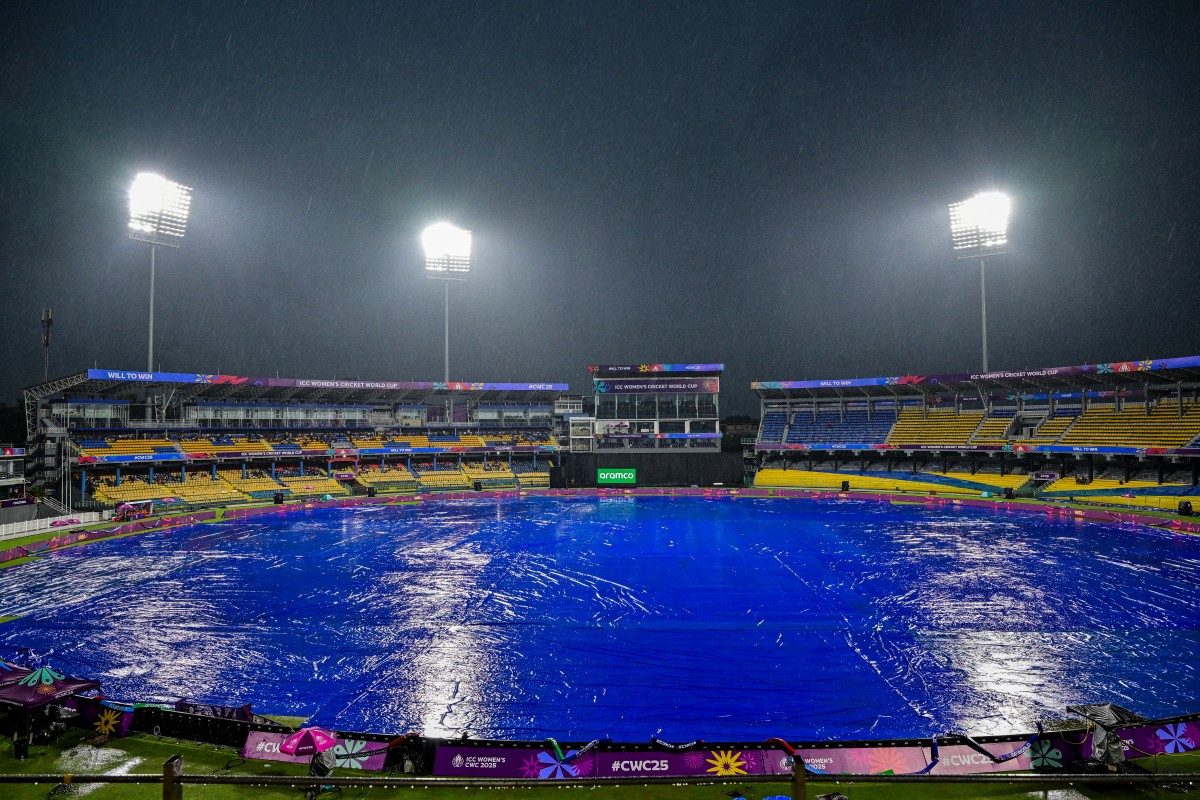 A general view shows covered ground after the ICC Women's Cricket World Cup 2025 one-day international (ODI) match between Sri Lanka and Australia was abandoned due to rain at the R. Premadasa International Cricket Stadium in Colombo on October 4, 2025. The Women's World Cup clash between co-hosts Sri Lanka and holders Australia in Colombo was abandoned without a ball being bowled on October 4 because of persistent rain. (Photo by Ishara S. KODIKARA / AFP)