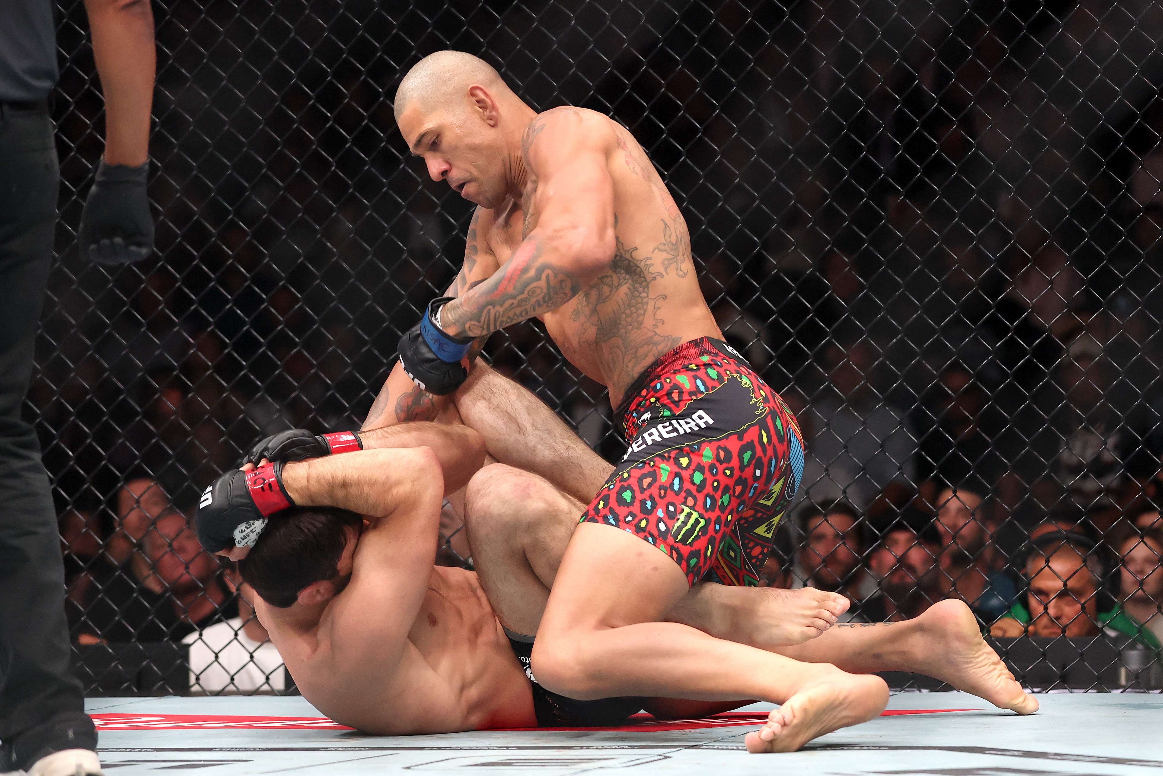 Alex Pereira and Magomed Ankalaev in action.