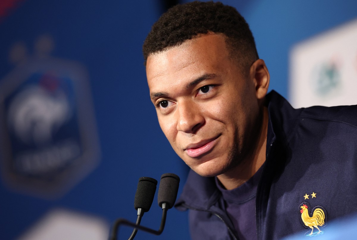 Kylian Mbappe speaks during a news conference.