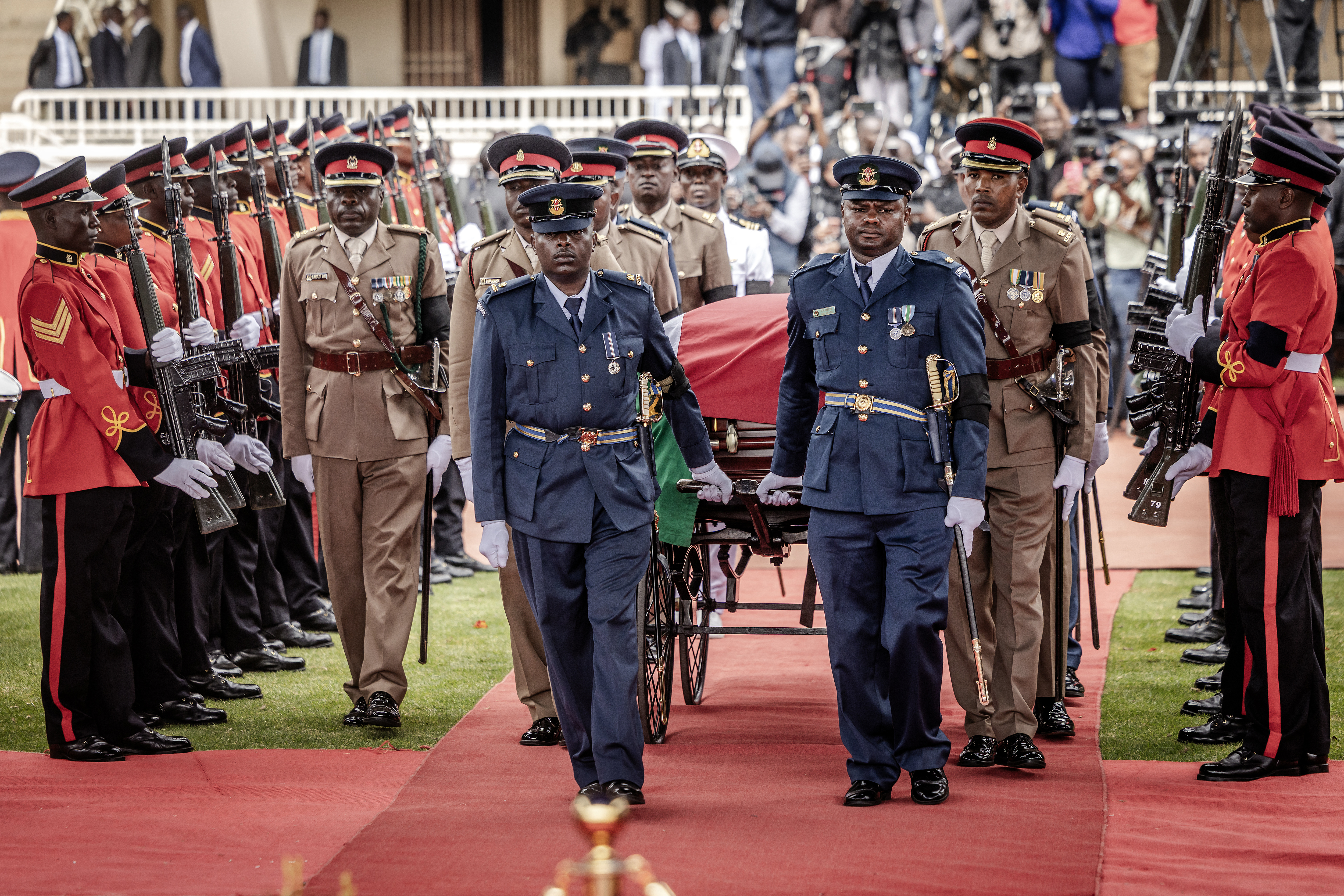 Senior Kenya Army officials flank the coffin of Kenya's opposition leader and former prime minister Raila Odinga during his state funeral.