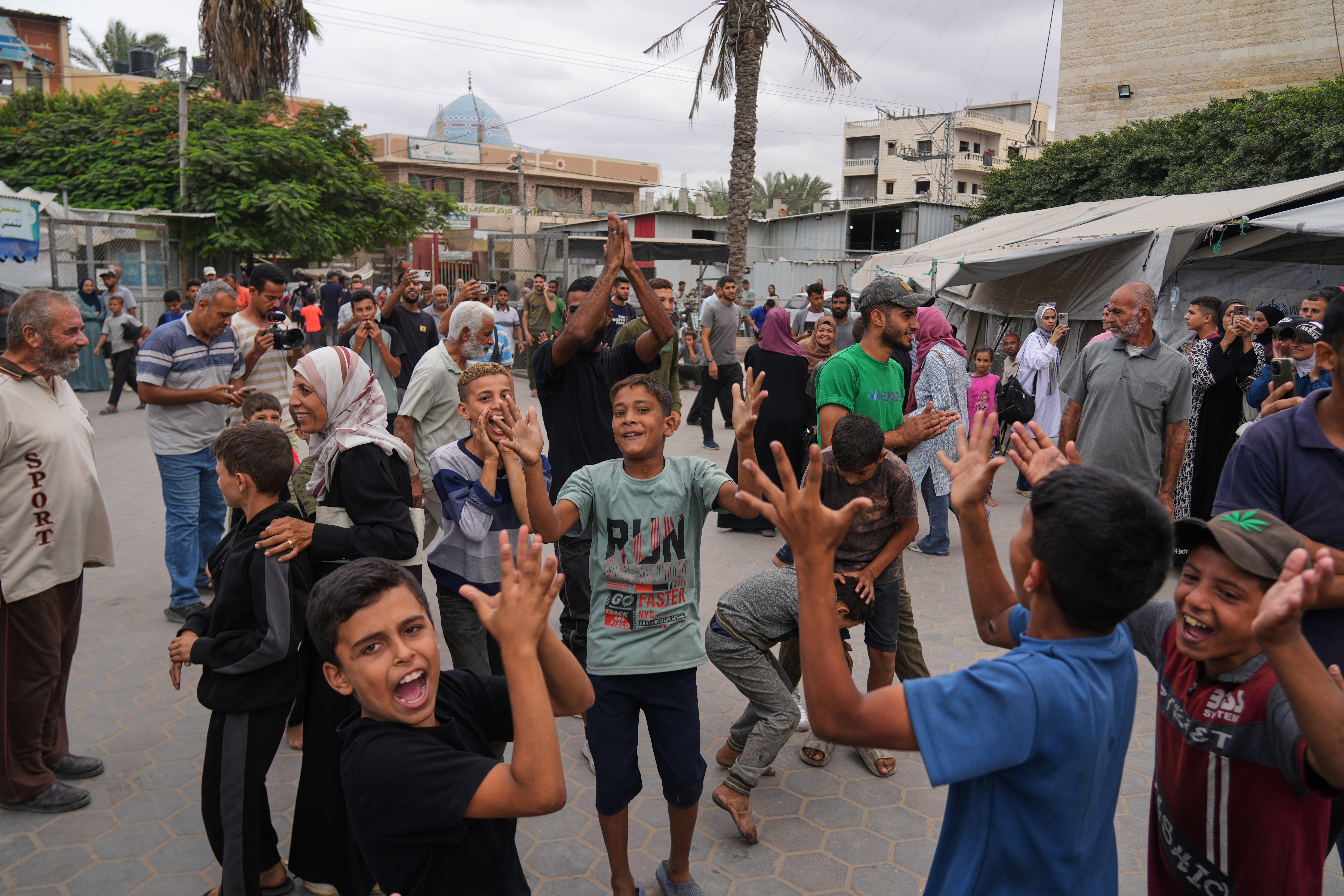 Gaza residents flood streets in hope of ending prolonged war