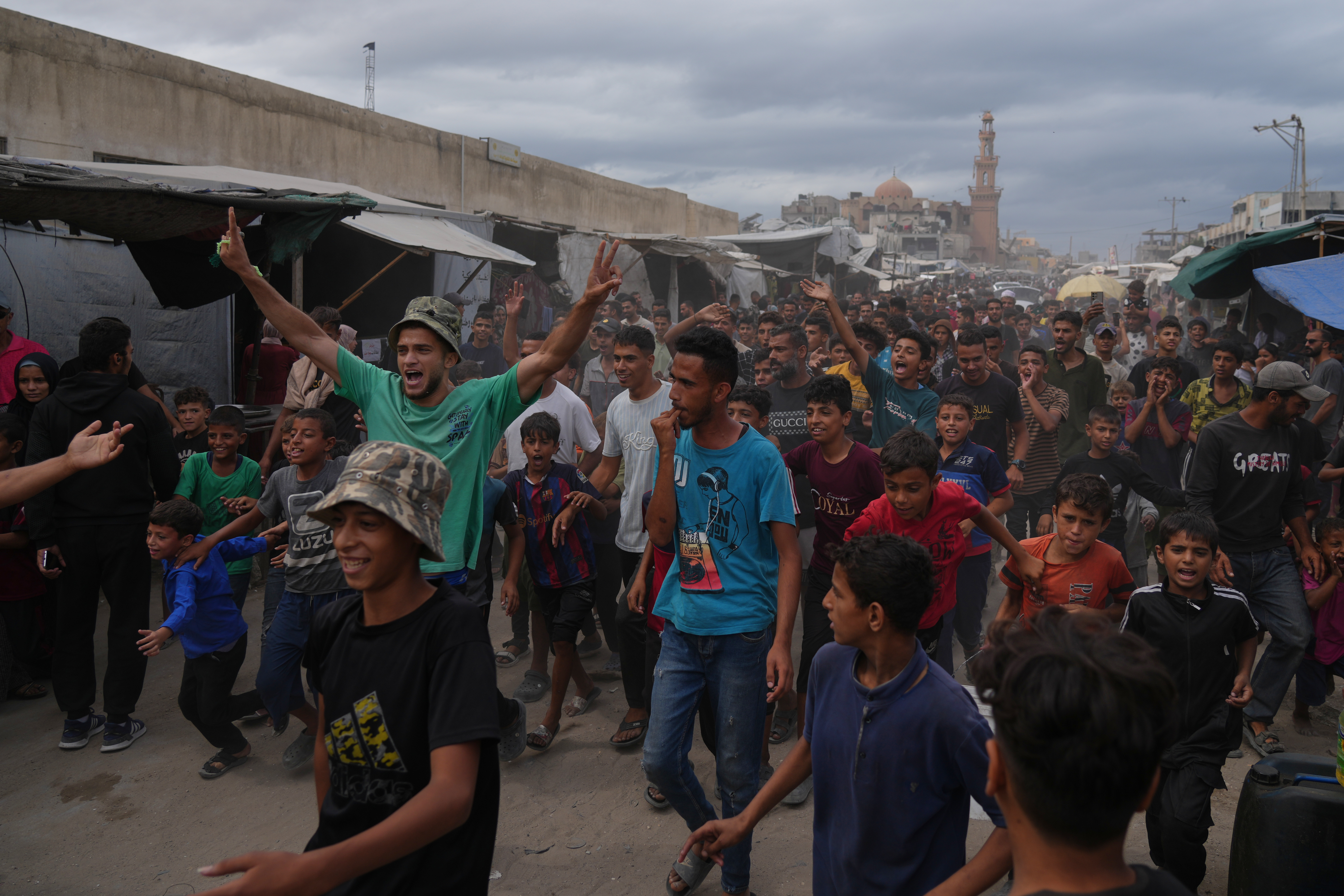 Gaza residents flood streets in hope of ending prolonged war