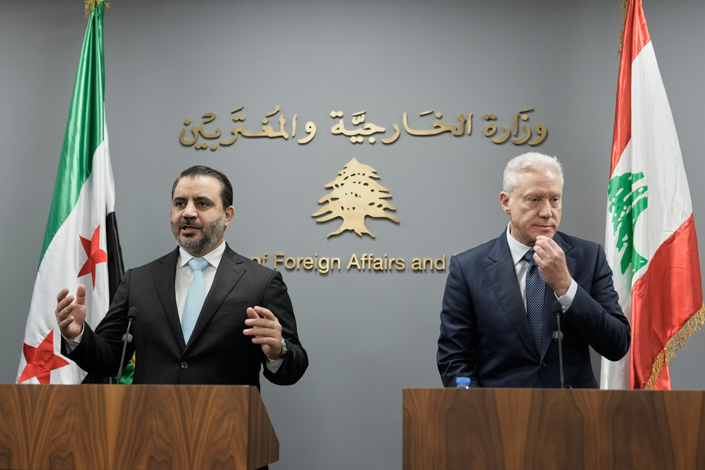 Syrian Foreign Minister Asaad al-Shibani, left, on visit to Lebanon