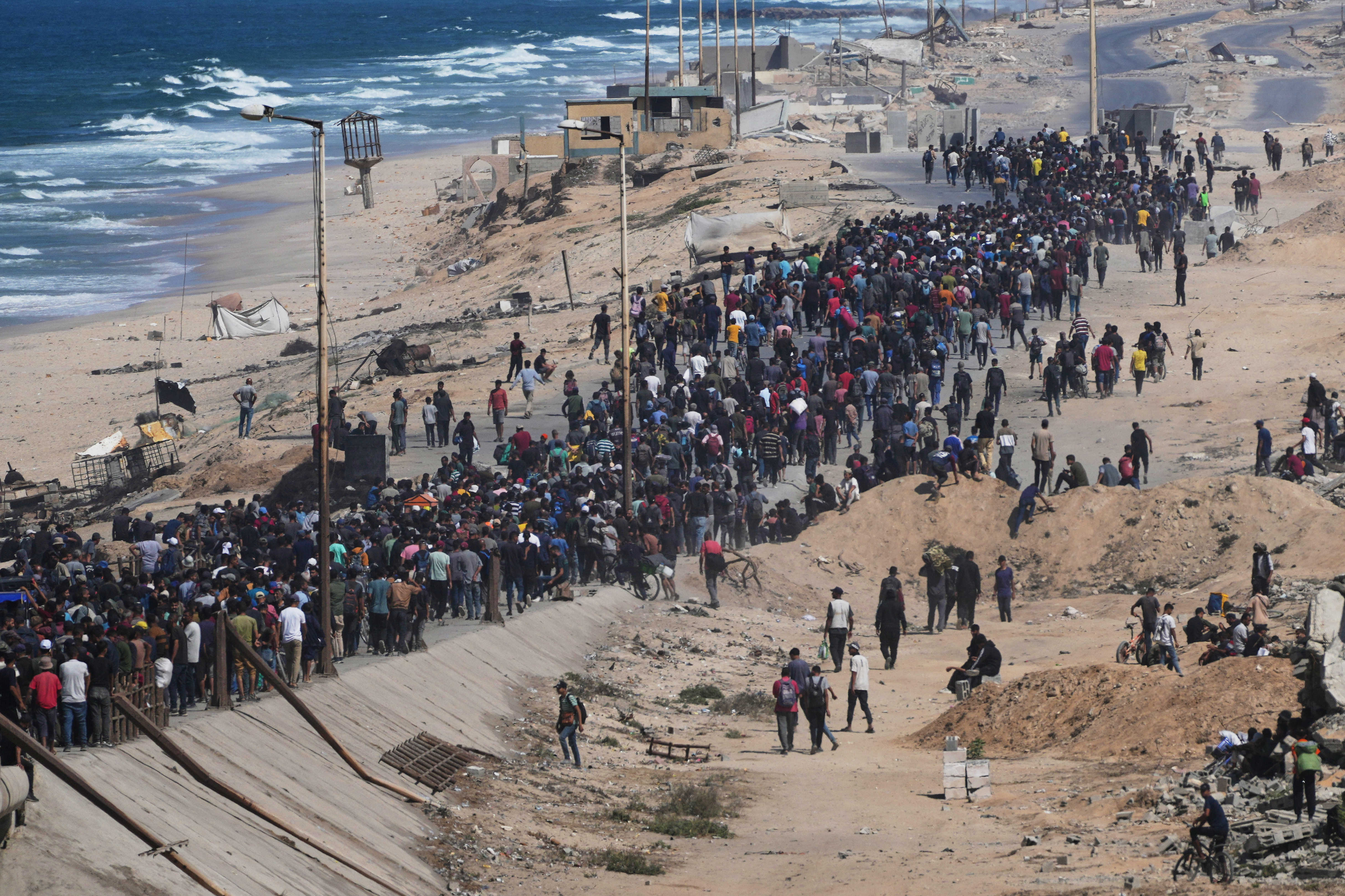 Displaced Palestinians return home as Israel begins Gaza withdrawal