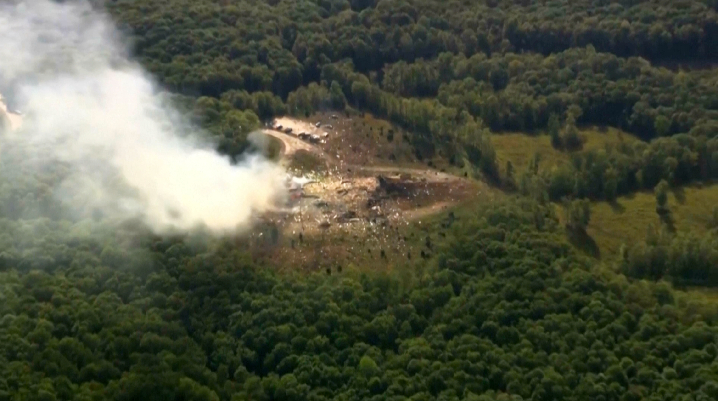 Smoke billows into the sky from a forested area in Tennessee