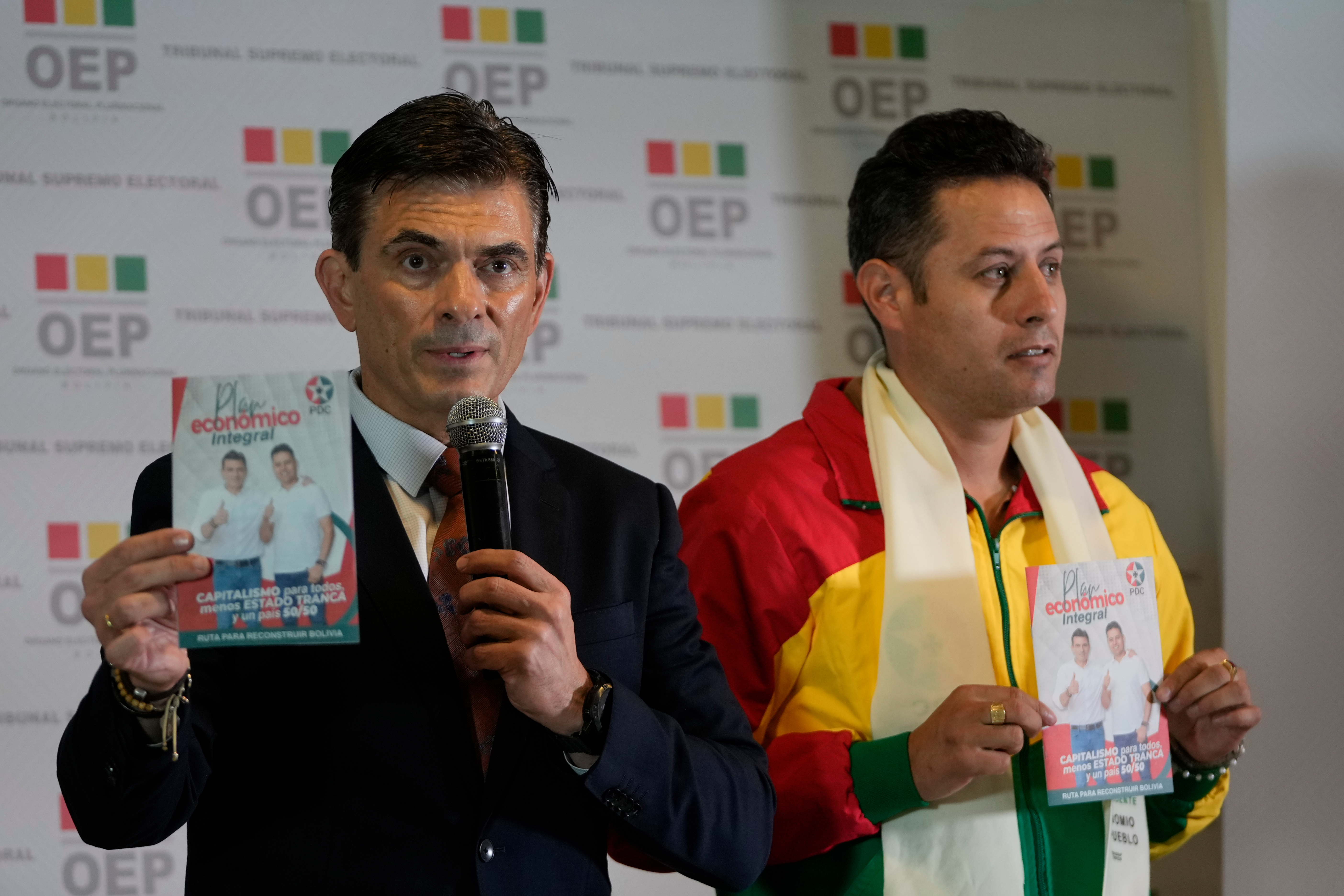 Rodrigo Paz and Edman Lara stand together before the presidential debate