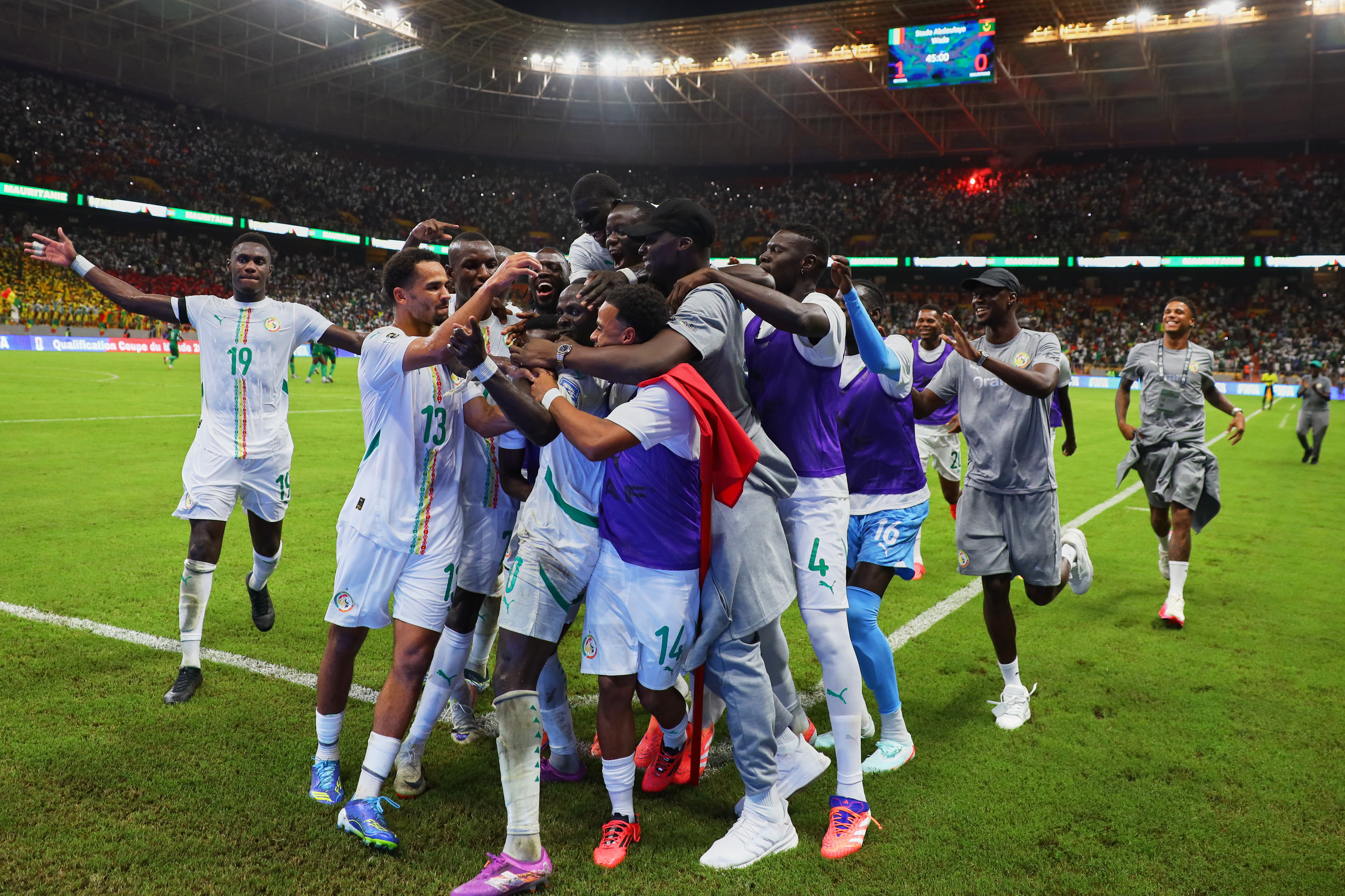 Senegal's Sadio Mane, Left, celebrates with teammates after scoring his side's first goal during a World Cup Group B qualifying soccer match between Senegal and Mauritania