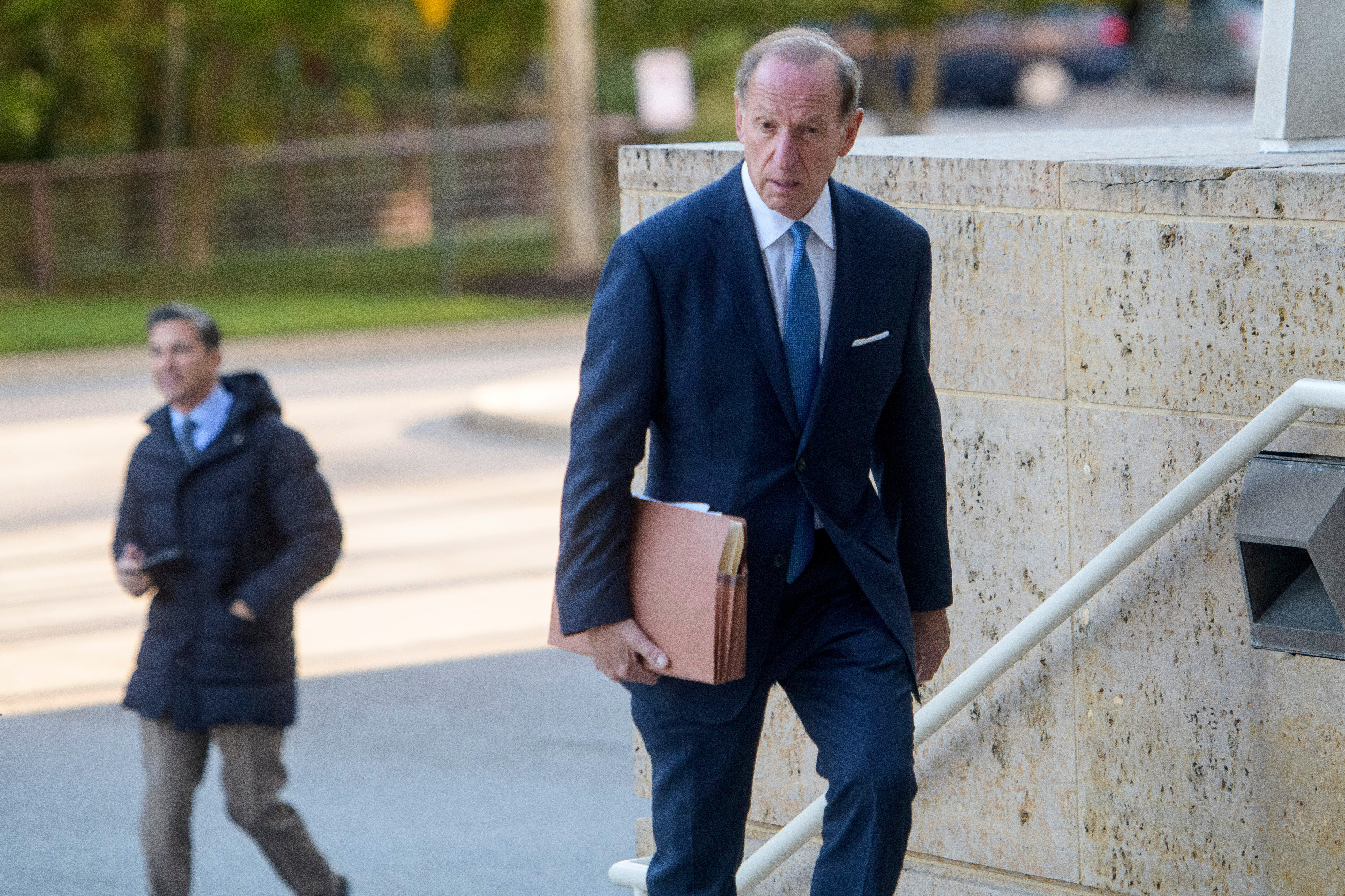 Abbe Lowell climbs the steps to the Maryland federal courthouse