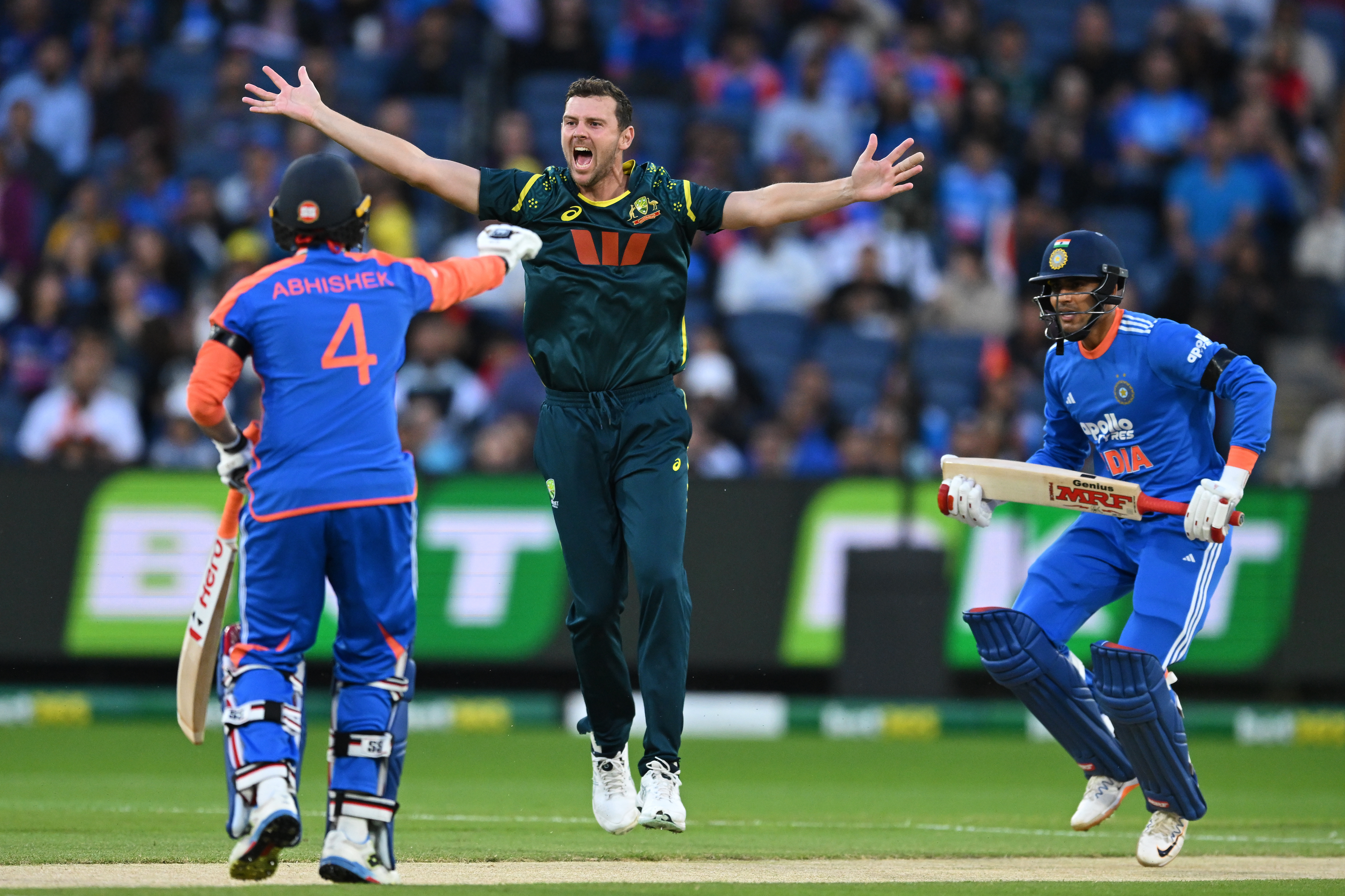Australia's Josh Hazlewood, centre