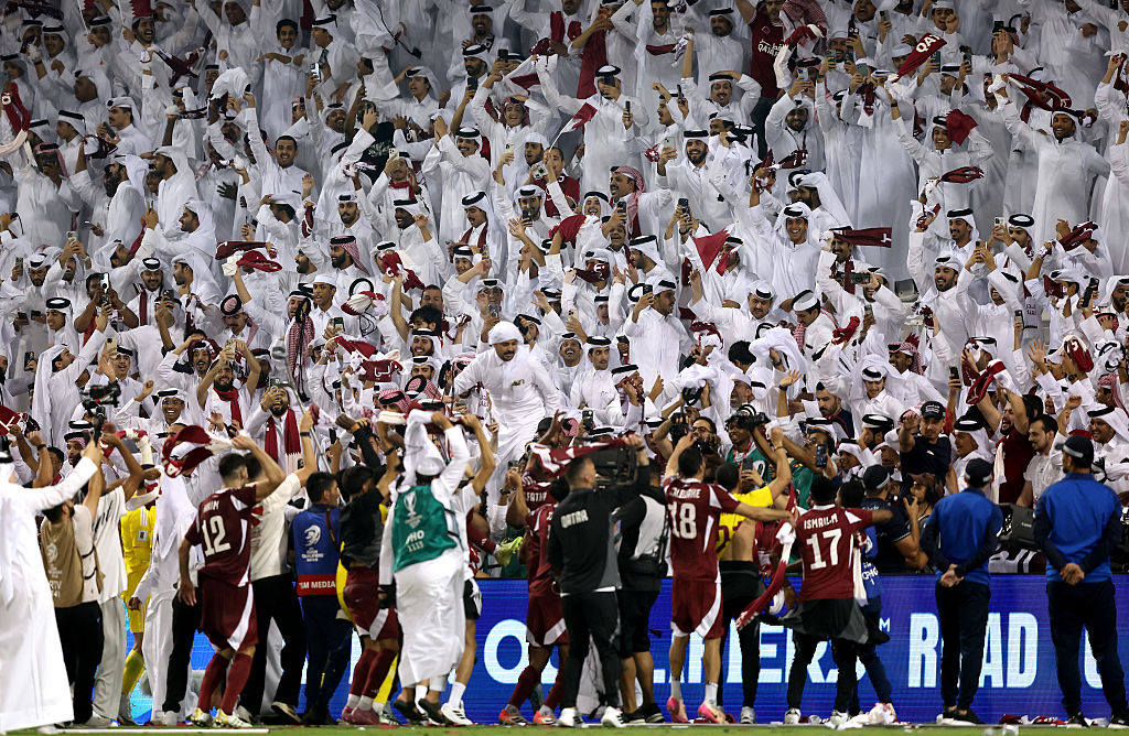 Qatar fans celebrate their team's victory after the FIFA World Cup 2026 qualifier match between Qatar and United Arab Emirates at Jassim Bin Hamad Stadium