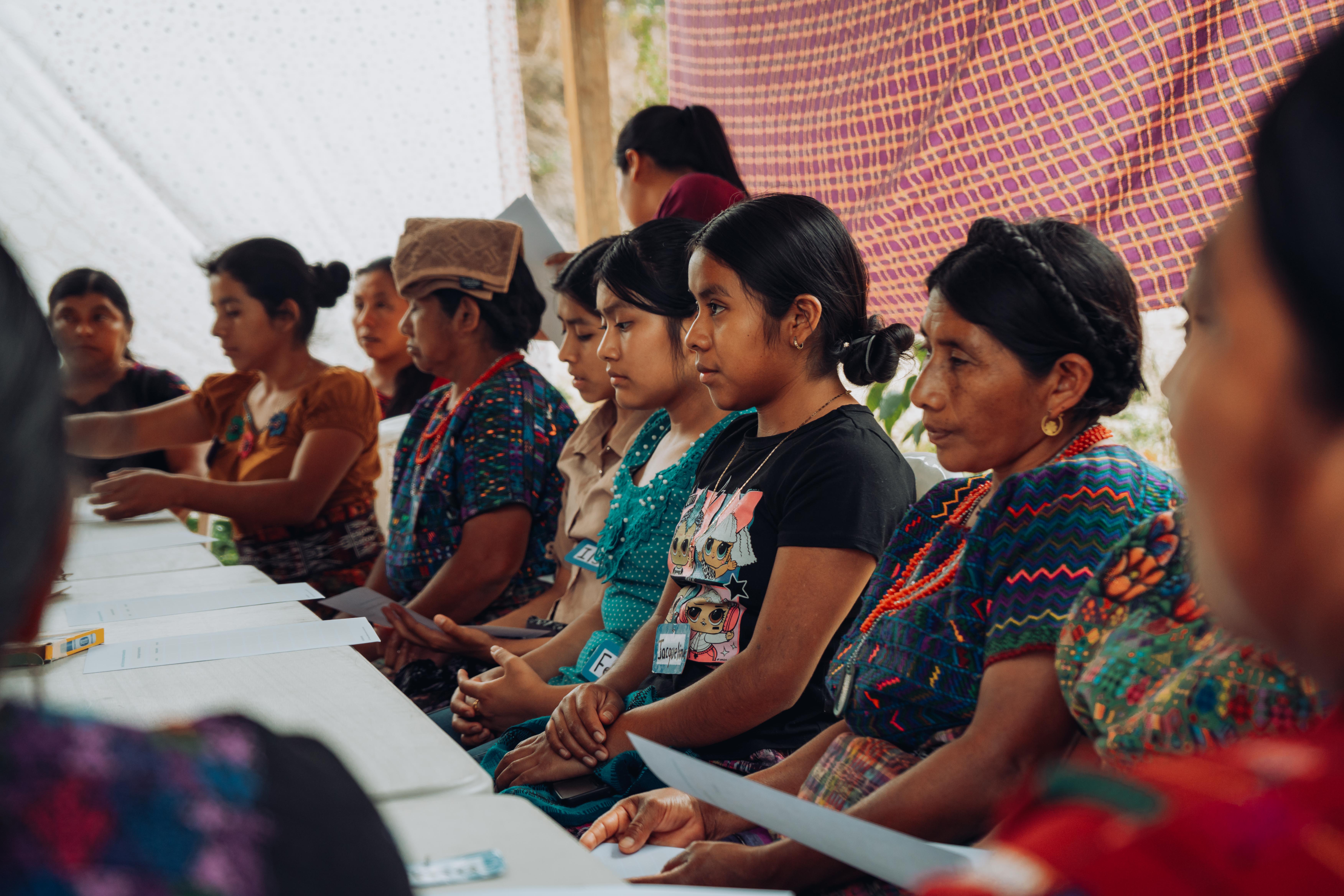 Women take part in an “emotions game,” one of several activities designed to help them recognize and express their feelings.