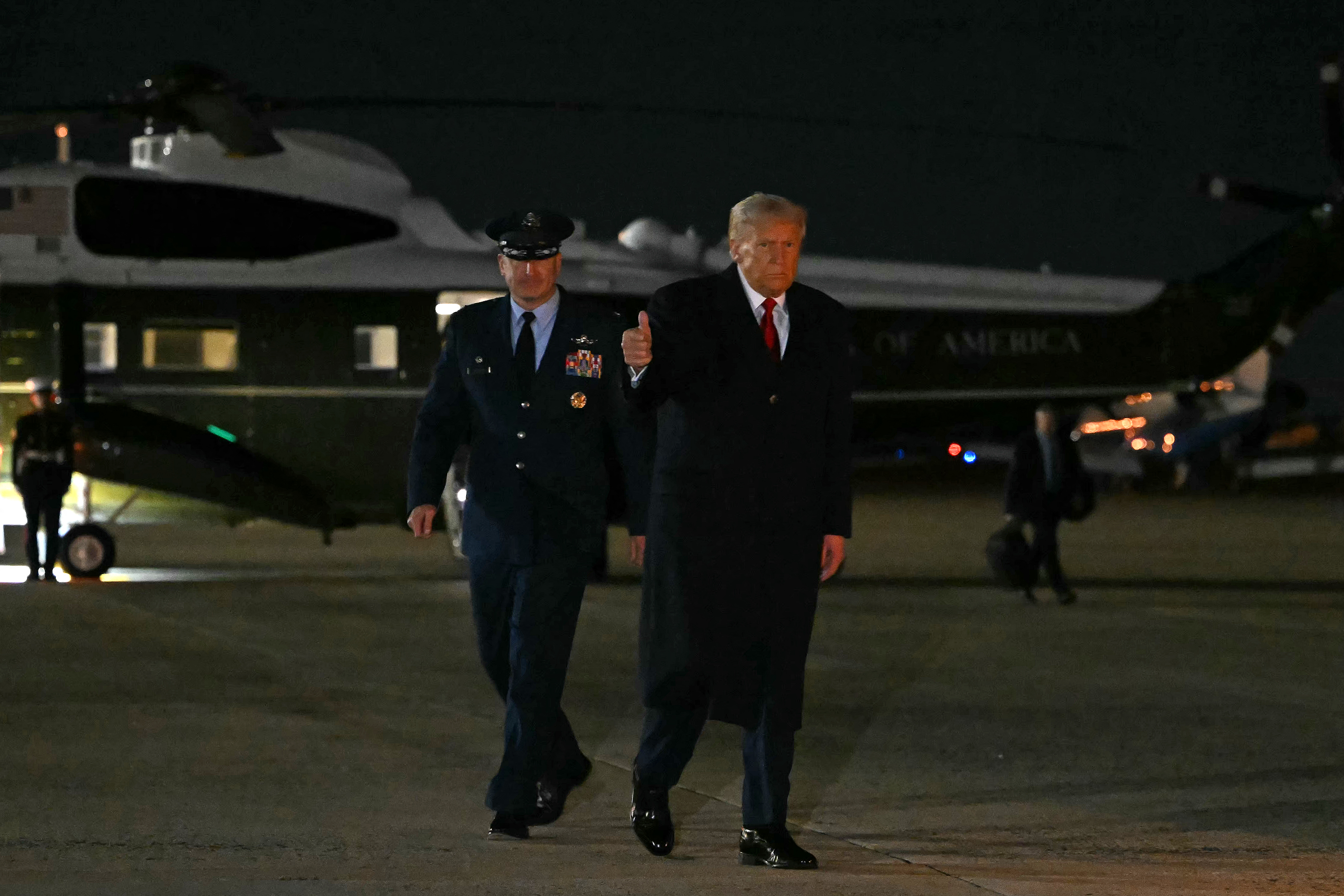 US President Donald Trump boards Air Force One at Joint Base Andrews, Maryland, as he departs for a trip to Asia on October 24, 2025. (Photo by ANDREW CABALLERO-REYNOLDS / AFP)