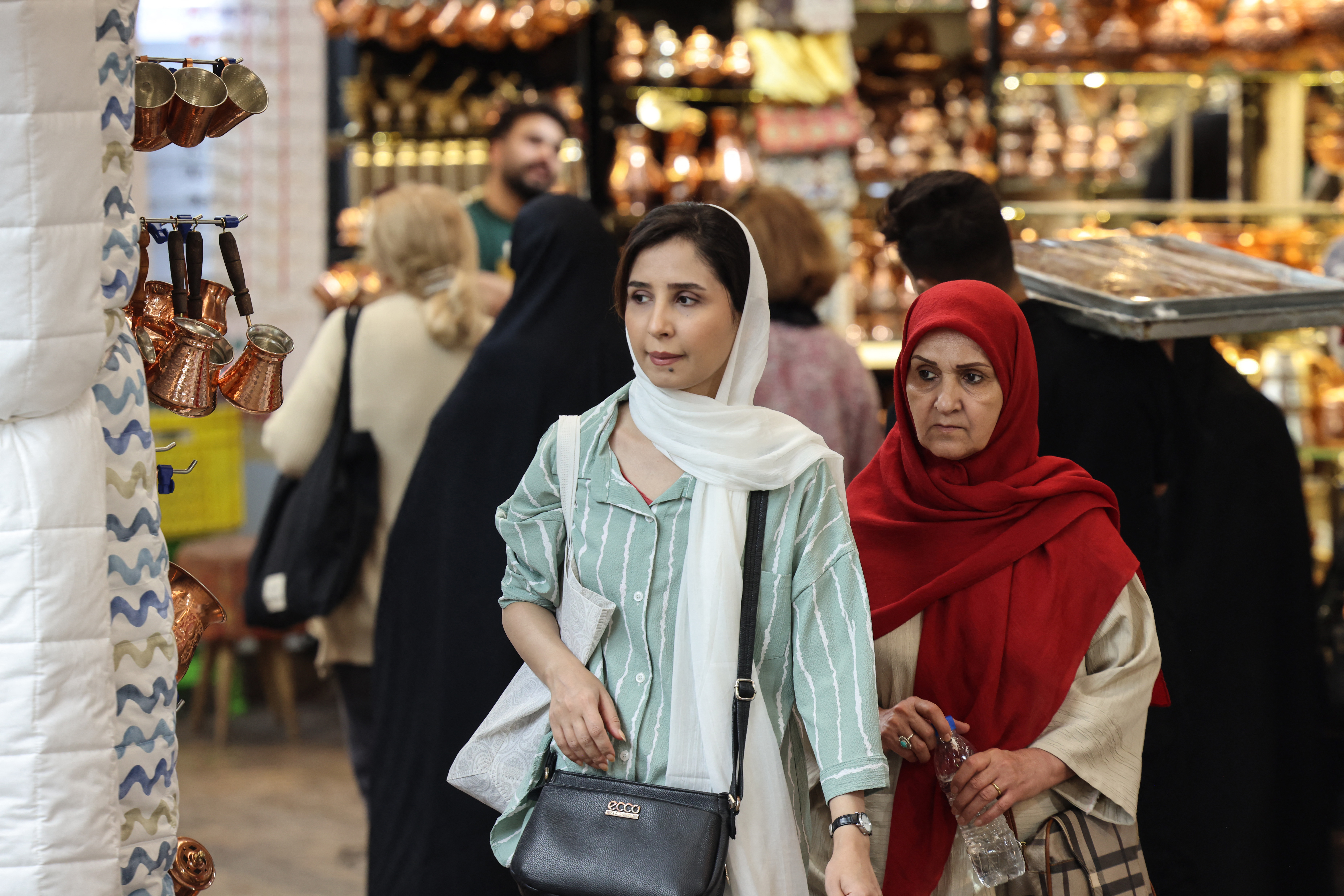 Women shop at Tajrish Bazaar in the Iranian capital Tehran on October 25, 2025.