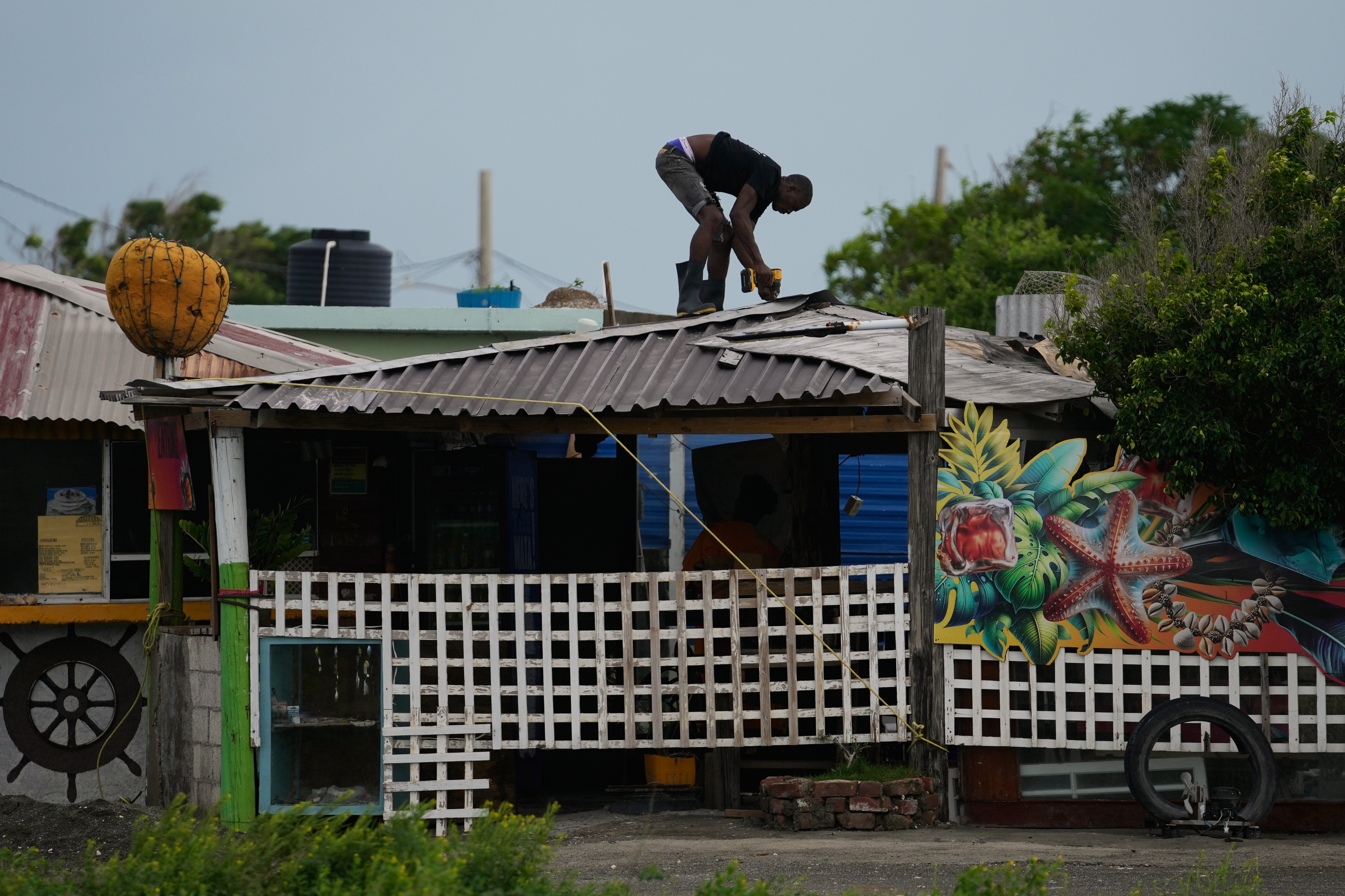 A man fortifies a roof.
