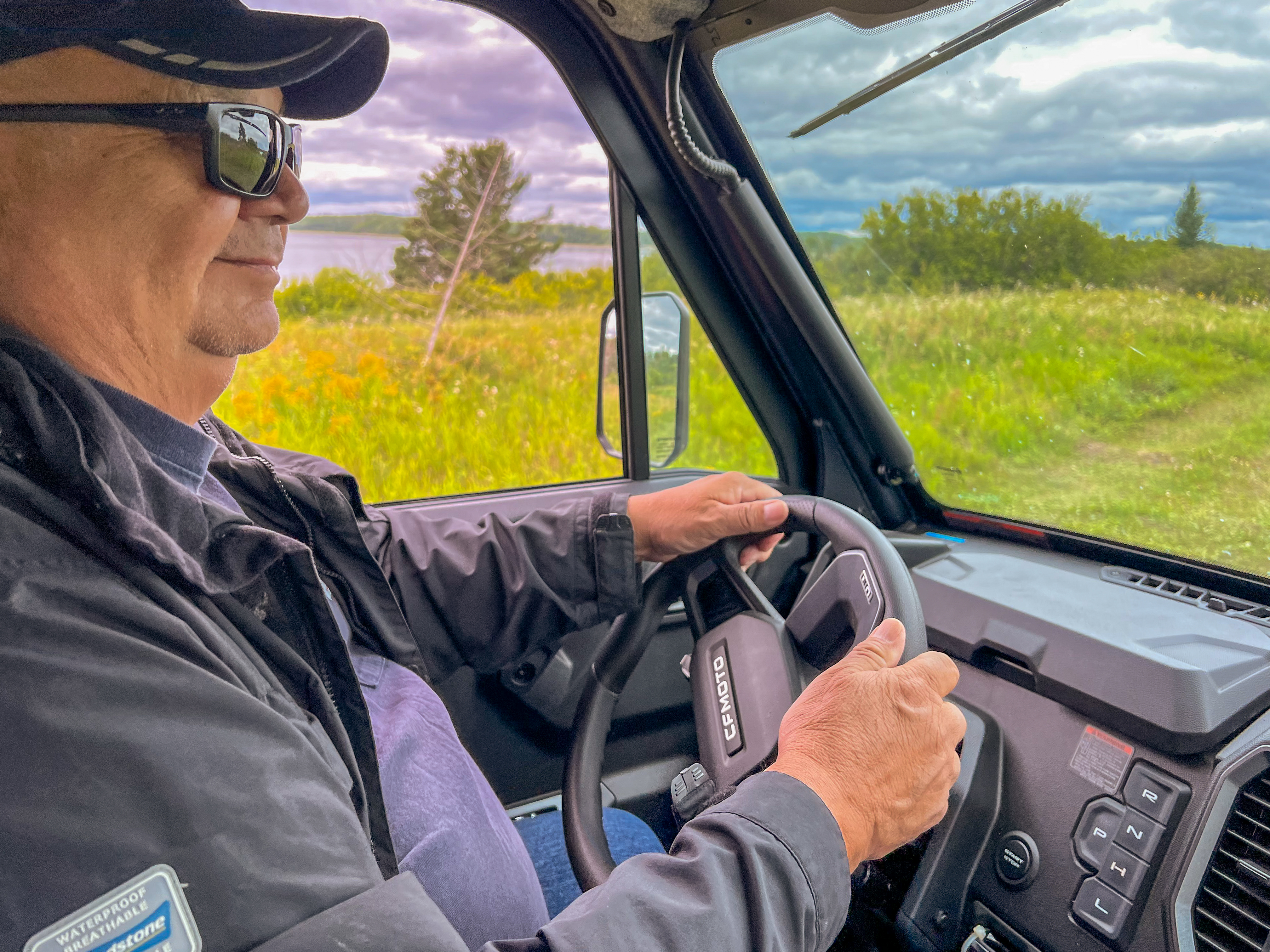 JB Fobister drives his quad on dirt roads in Grassy Narrows
