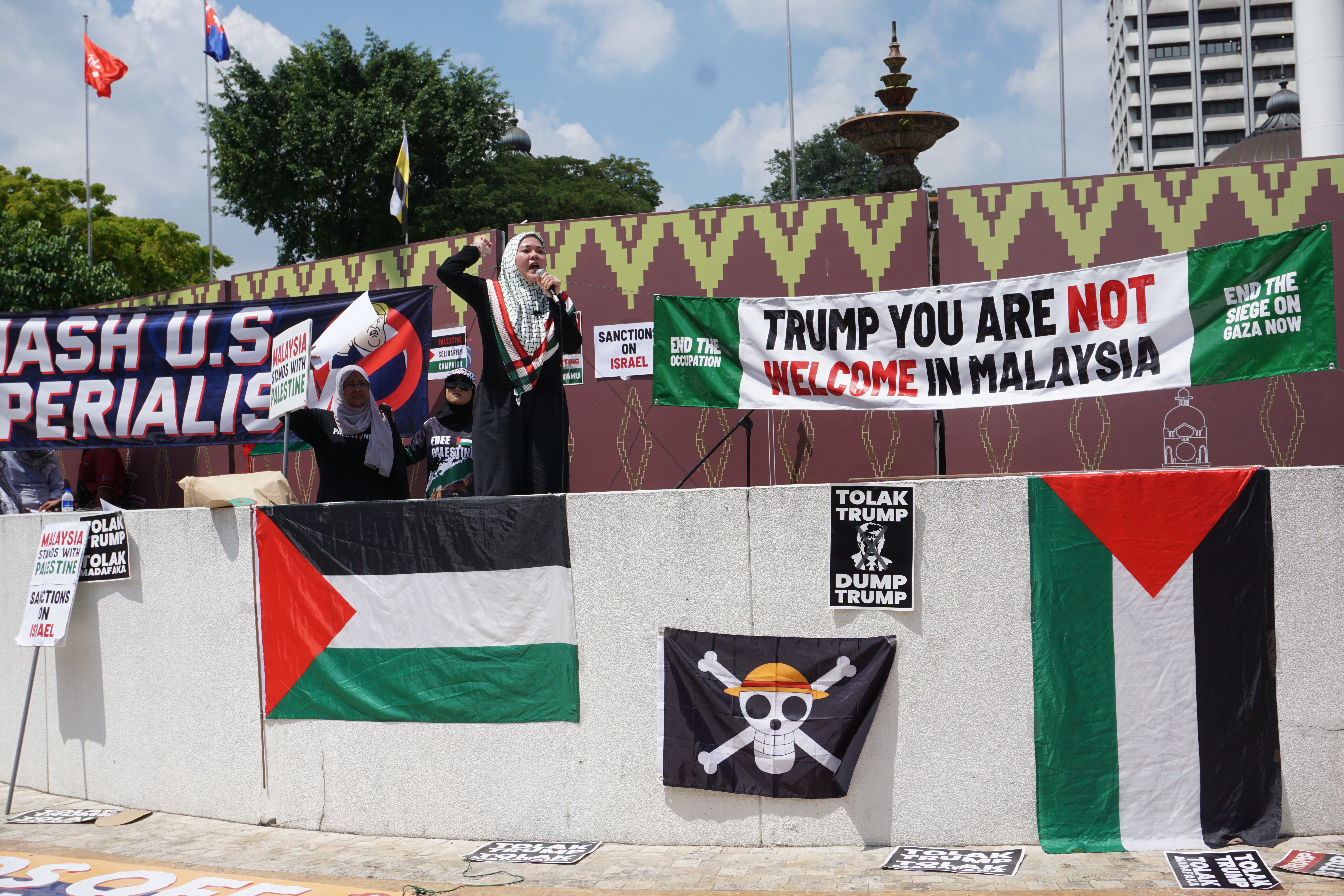 Protesters rally against US President Donald Trump's visit to Malaysia at Kuala Lumpur's Independence Square on October 26, 2025. [Erin Hale/ Al Jazeera]