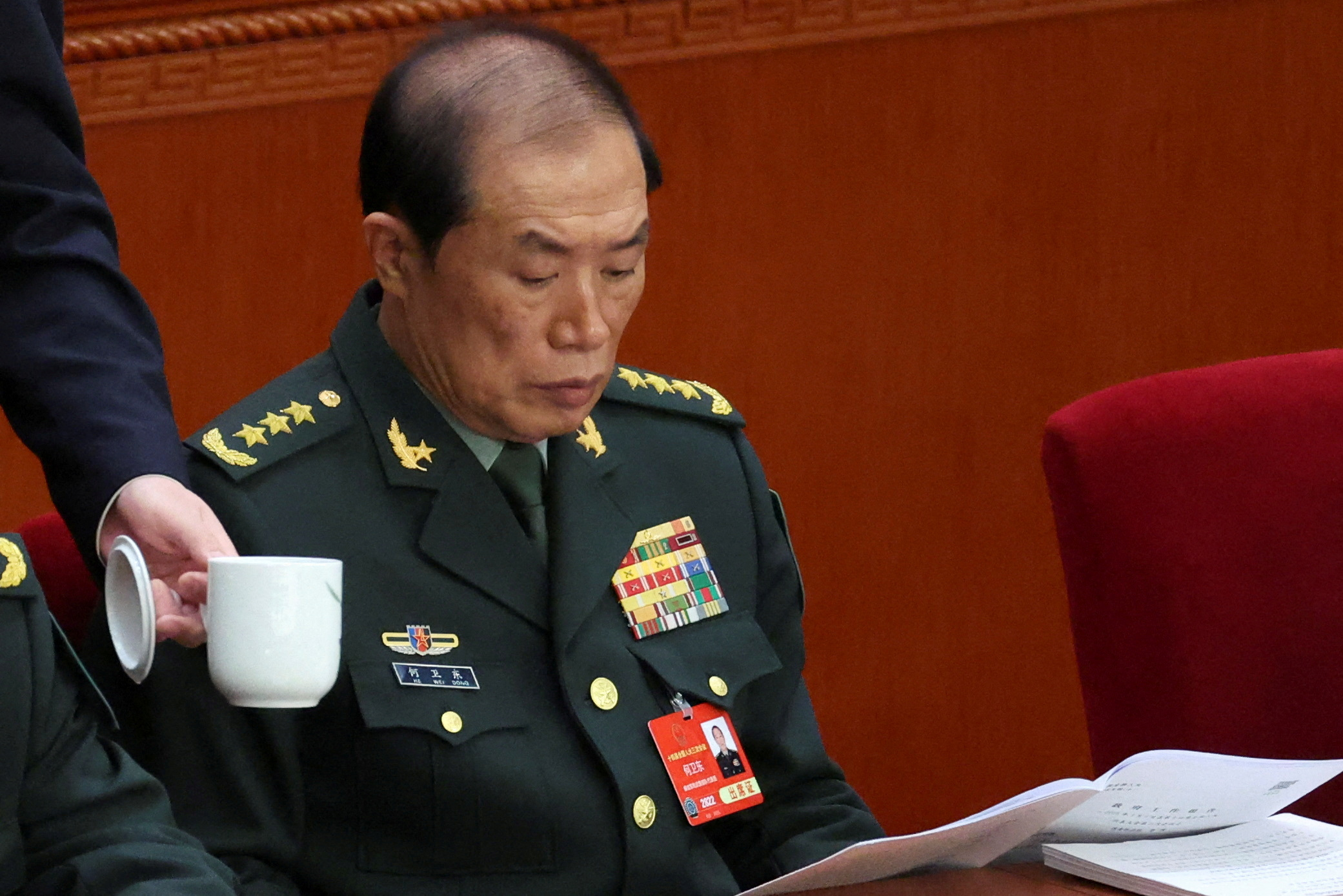 FILE PHOTO: Central Military Commission Vice Chairman He Weidong attends the opening session of the National People's Congress (NPC) at the Great Hall of the People in Beijing, China March 5, 2025. REUTERS/Florence Lo/File Photo
