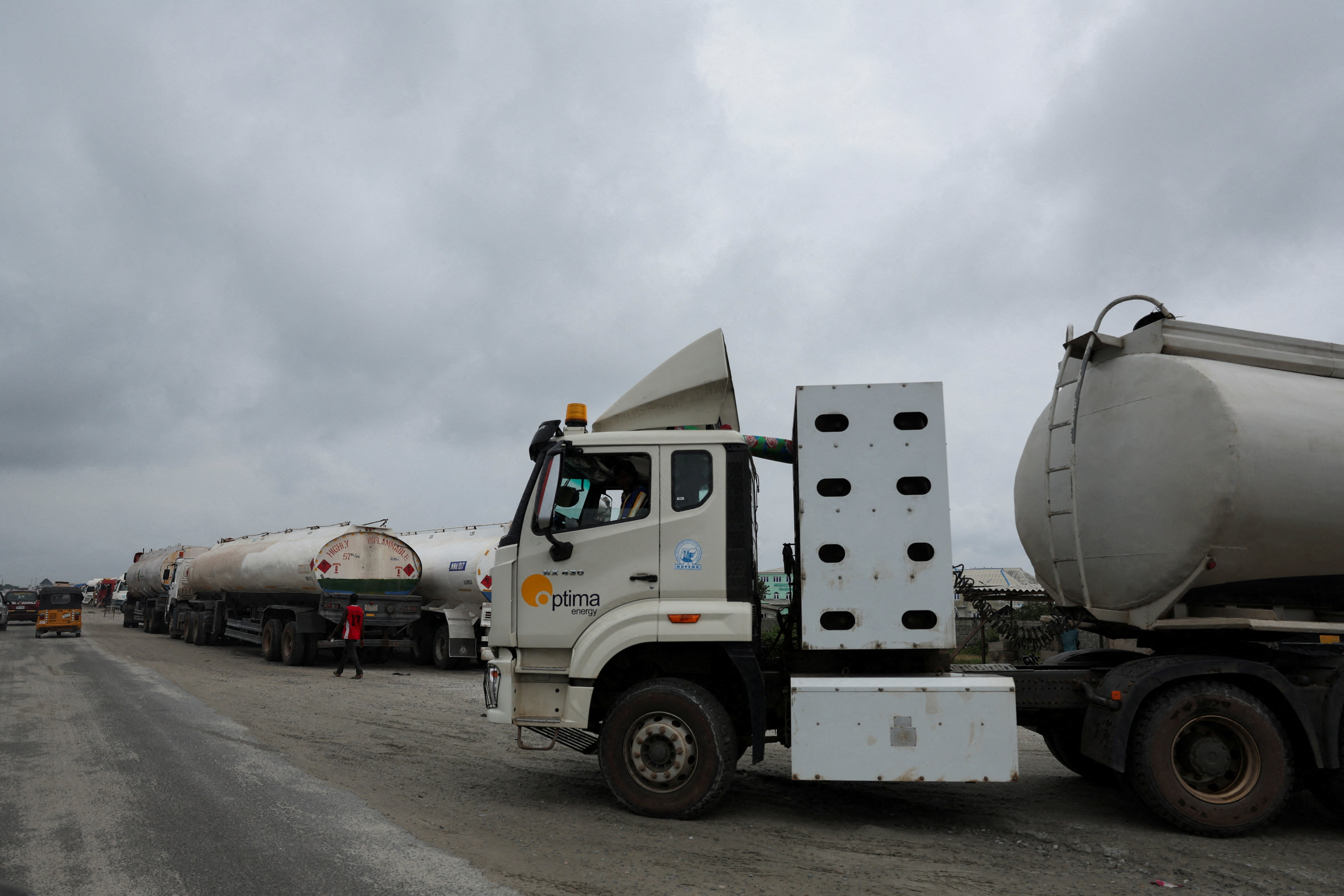 FILE PHOTO: A petrol tanker drives out of the Dangote Petroleum Refinery headquarters gate in Ibeju-Lekki, Lagos, Nigeria, July 8, 2025. REUTERS/Sodiq Adelakun/File Photo