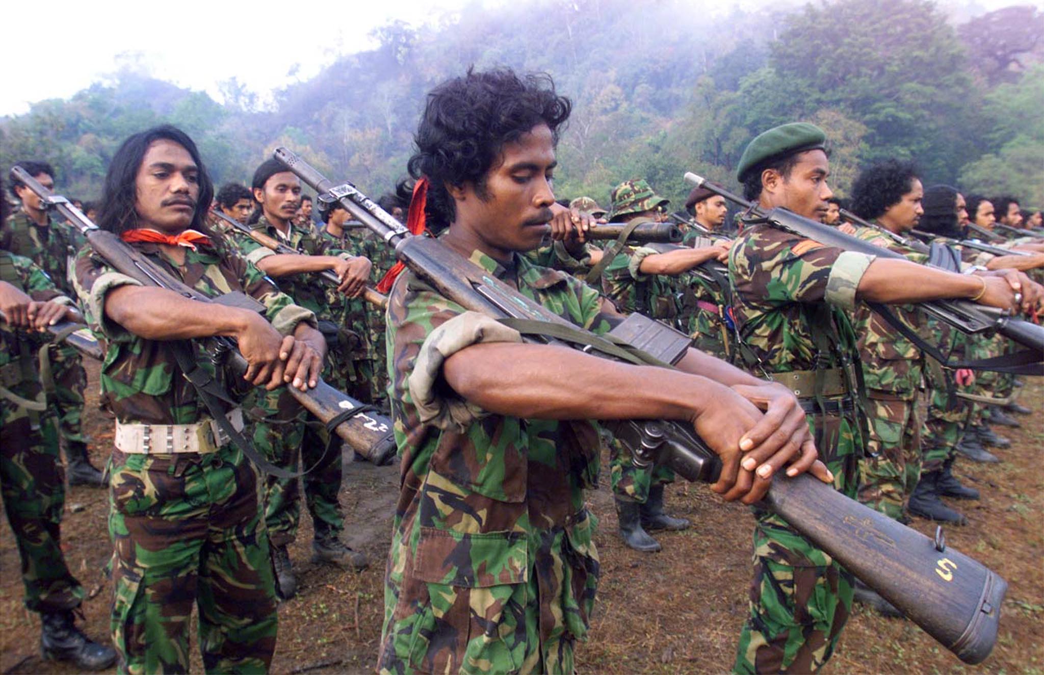 Falintil (Armed Forces for the Liberation of East Timor) soldiers drill at their guerrilla base in the Viqueque district in East Timor August 7. Falintil, which has been fighting a guerrilla war for independence since the Indonesian invasion in 1975, has agreed to confine its fighters to camps under United Nations observation before the August 30 ballot on the future of the territory. DW/PB/WS