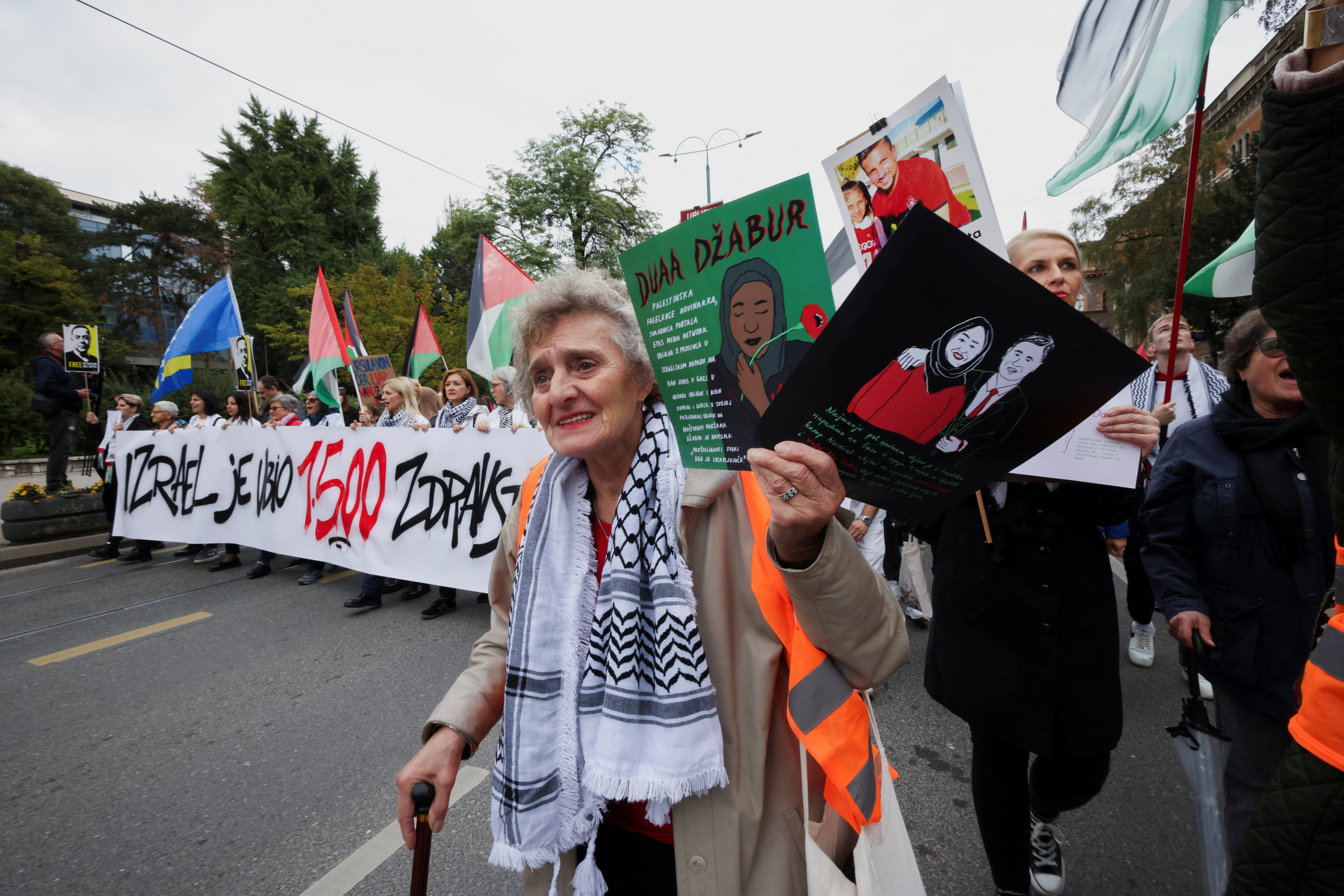 Bosnian women hold photos of killed Palestinians during a protest to show solidarity with civilians in Gaza and urge Bosnian authorities to uphold international law, in Sarajevo, Bosnia and Herzegovina, October 12, 2025. REUTERS/Amel Emric