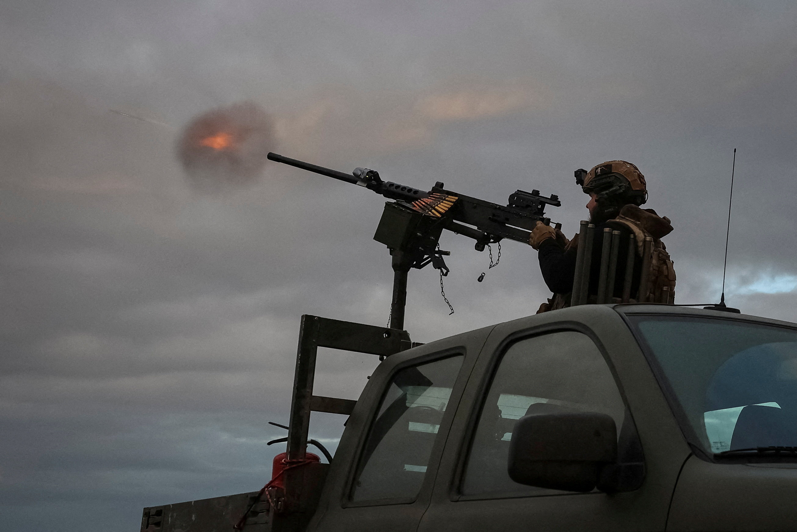 A serviceman from an anti-drone mobile air defence unit of the 38th Separate Marine Brigade of the Ukrainian Armed Forces fires a M2 Browning machine gun during combat shift on the front line, amid Russia's attack on Ukraine, in the Donetsk region, Ukraine October 20, 2025. REUTERS/Anatolii Stepanov