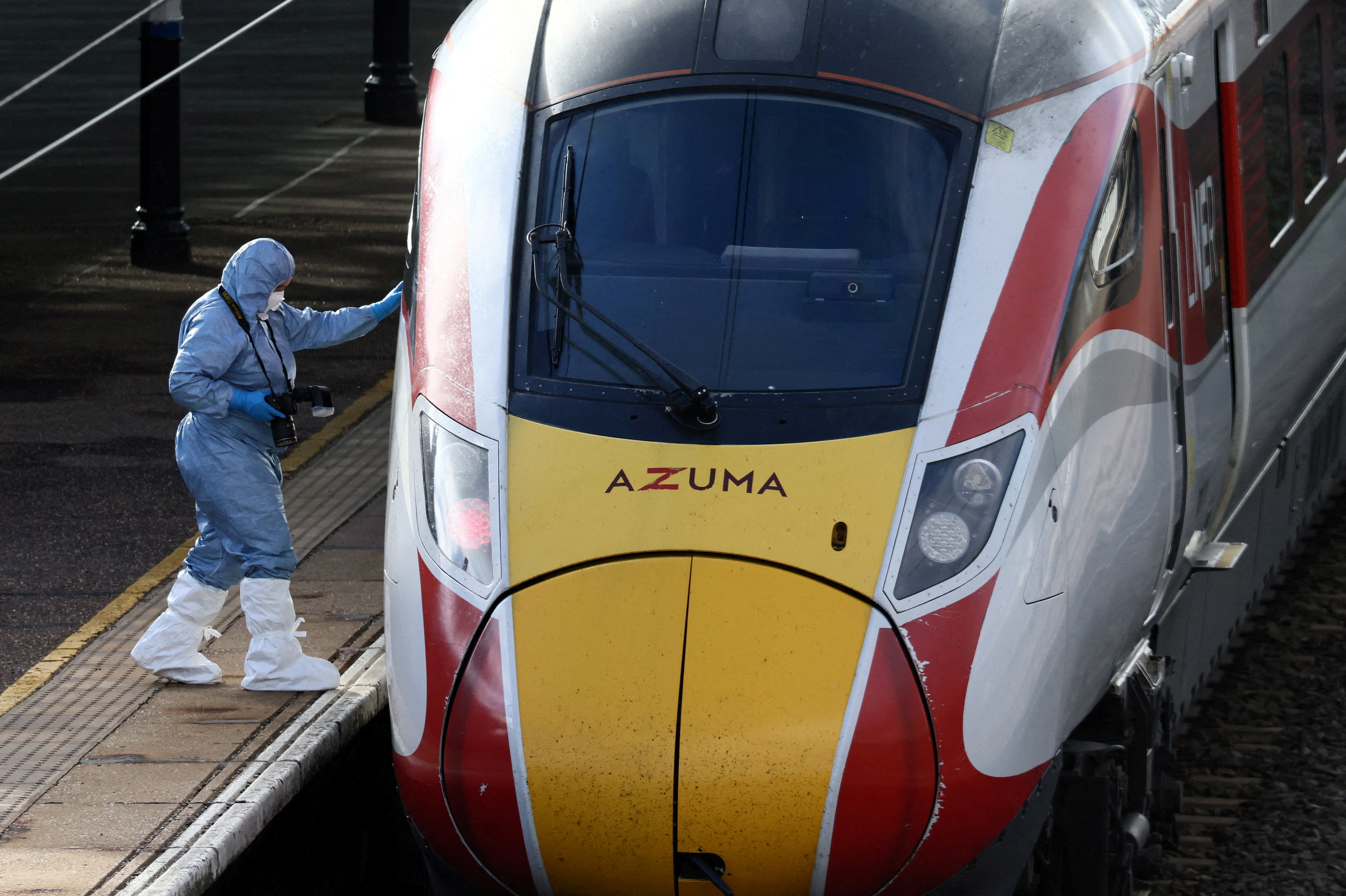 A forensic officer inspects the London North Eastern Railway (LNER) train where a series of stabbings took place, at a platform at Huntingdon Station, near Cambridge, Britain, November 2, 2025 [Jack Taylor/Reuters]