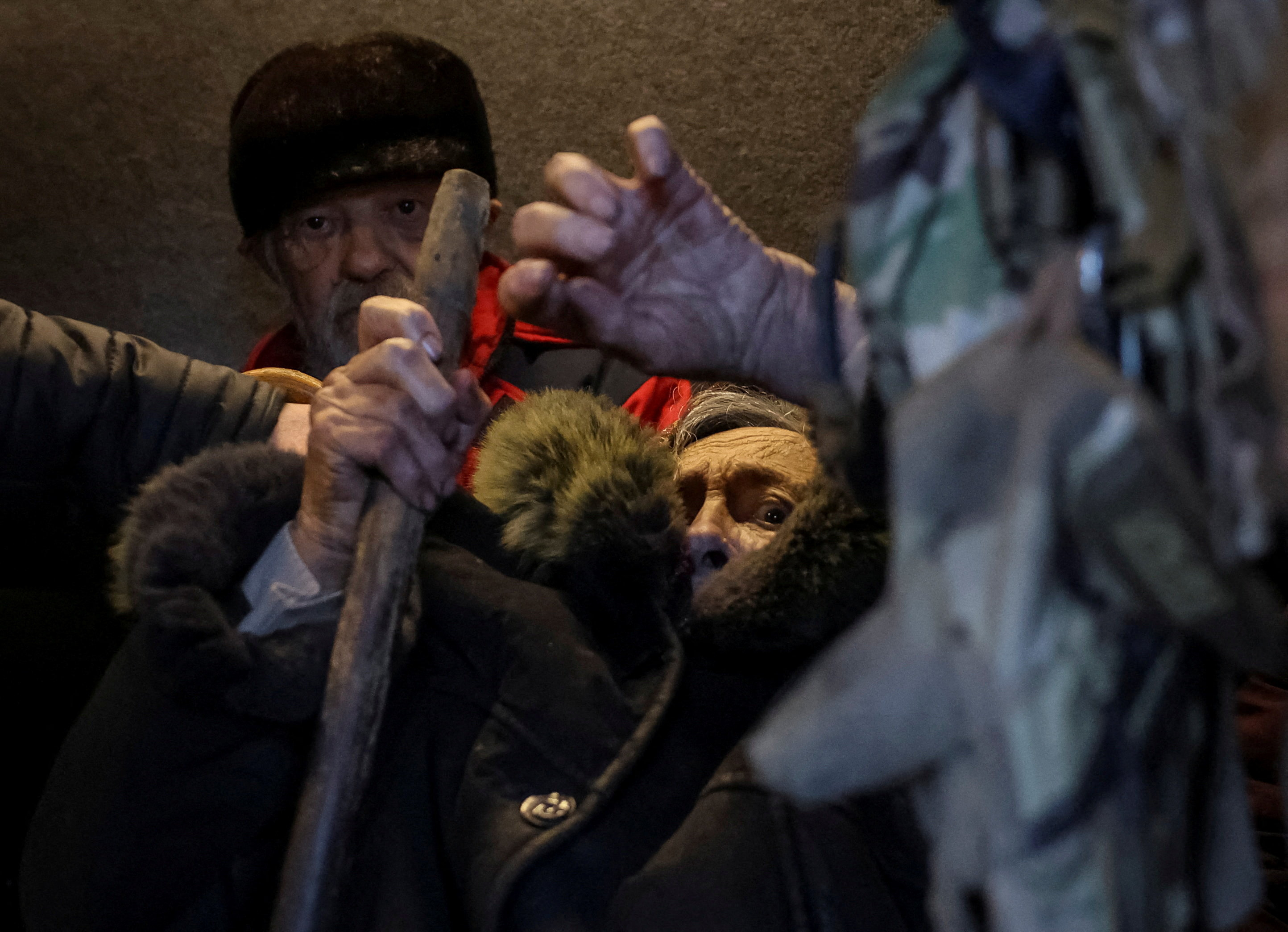 Residents sit in an armoured vehicle as members of the White Angel unit of Ukrainian police officers who evacuate people from the frontline towns and villages, evacuate them, amid Russia's attack on Ukraine, in the frontline town of Kostiantynivka in Donetsk region, Ukraine November 3, 2025. REUTERS/Anatolii Stepanov TPX IMAGES OF THE DAY
